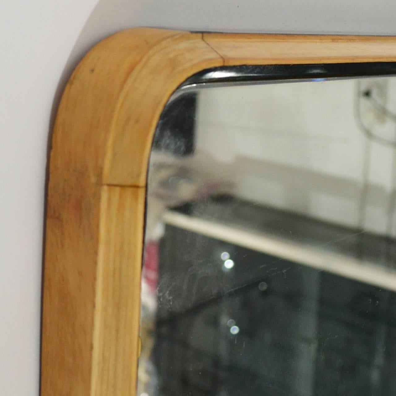Mirror with maple and ebonized wood trapezoidal frame.
From Cantù, Italy, 1950s.
Minimum width 124cm, maximum width 132cm, height 110cm.