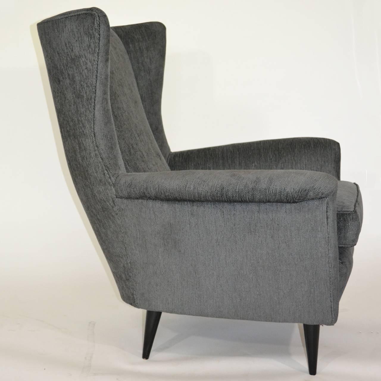 Pair of Italian grey velvet wings armchairs on cone legs from the 1950s.