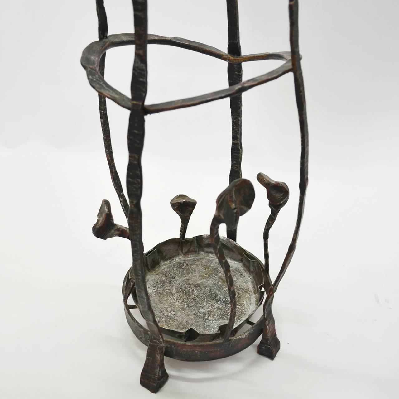 Metal sculptural umbrella stand from Italy in the 1960s signed by Marsura.
It is part of complete entrance hall set. Chairs, coats hooks, mirrors and wall lights are available.