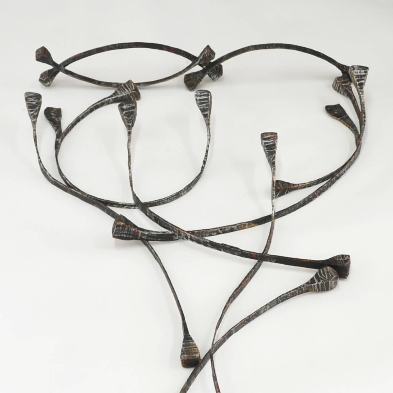Italian sculptural metal coat stands from the 1960s. Signed by Marsura.
It is part of complete entrance hall set. Mirror, coats hooks, umbrella stand, and wall light are available.