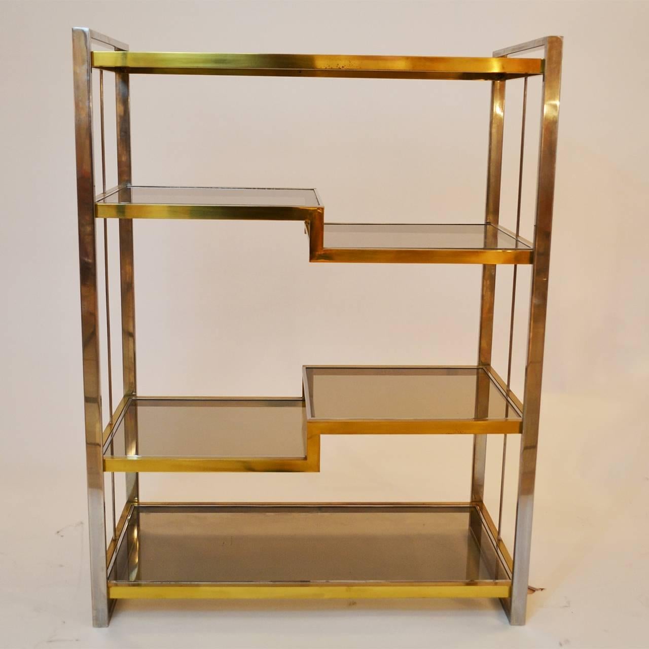 Steel and brass bookshelf with smoked glass shelves, Italy, 1970s.