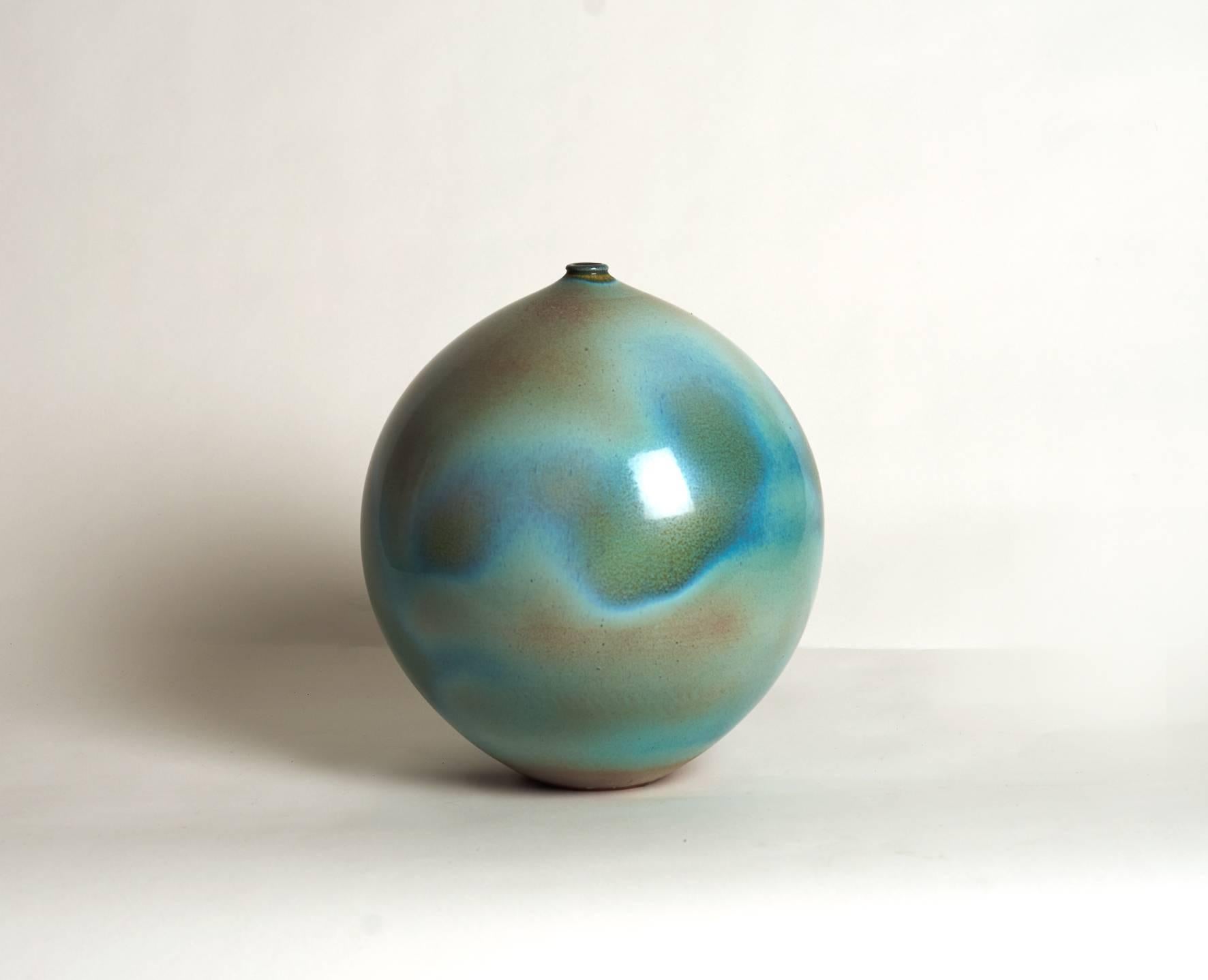 Suzanne Ramie (1907-1974), Vallauris, France

Ceramic vase by renowned French artist Suzanne Ramié having an amazing green/blue/turquoise glaze.
Incised on the bottom with the artist stamp mark 