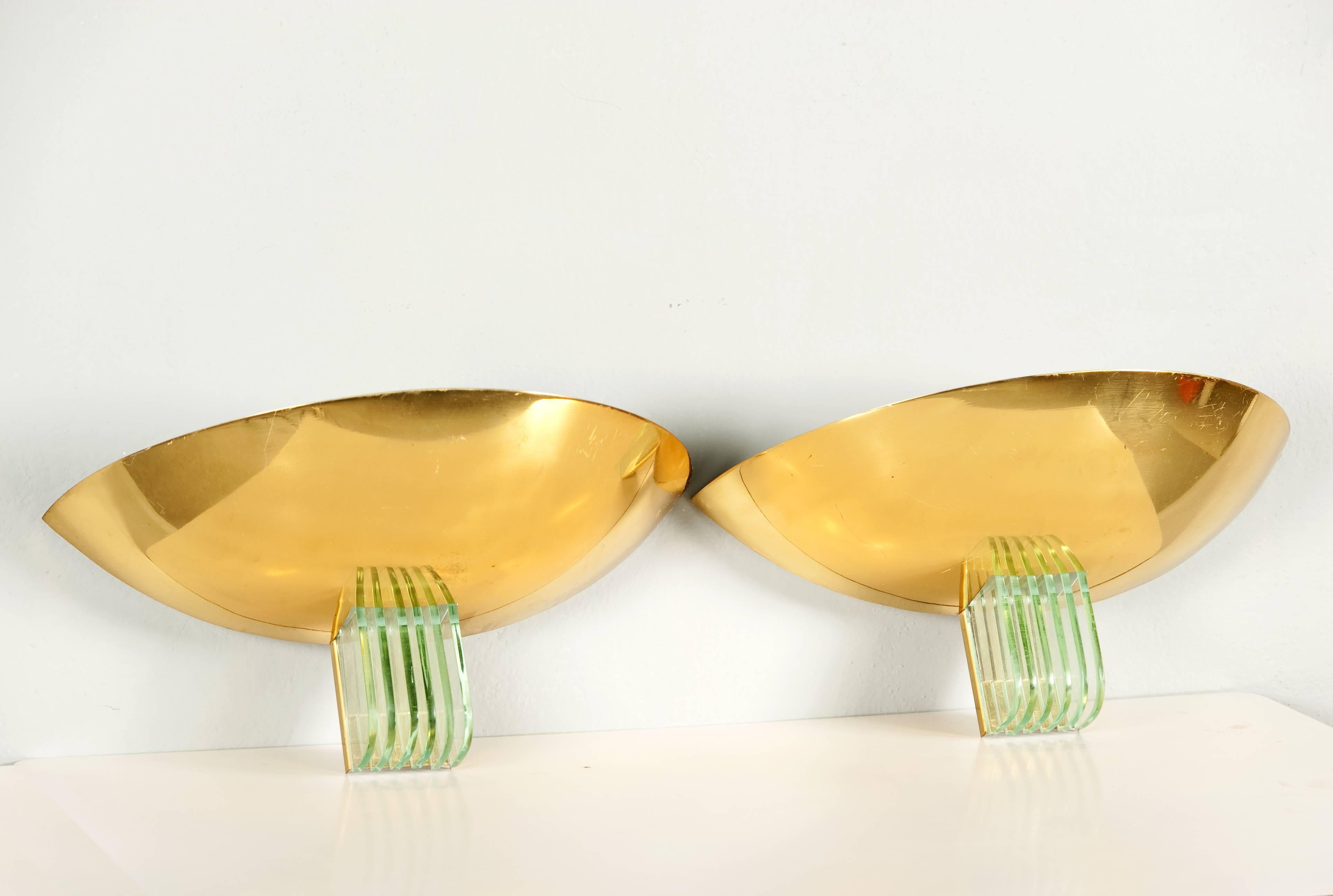 Stunning pair of brass and glass sconces.