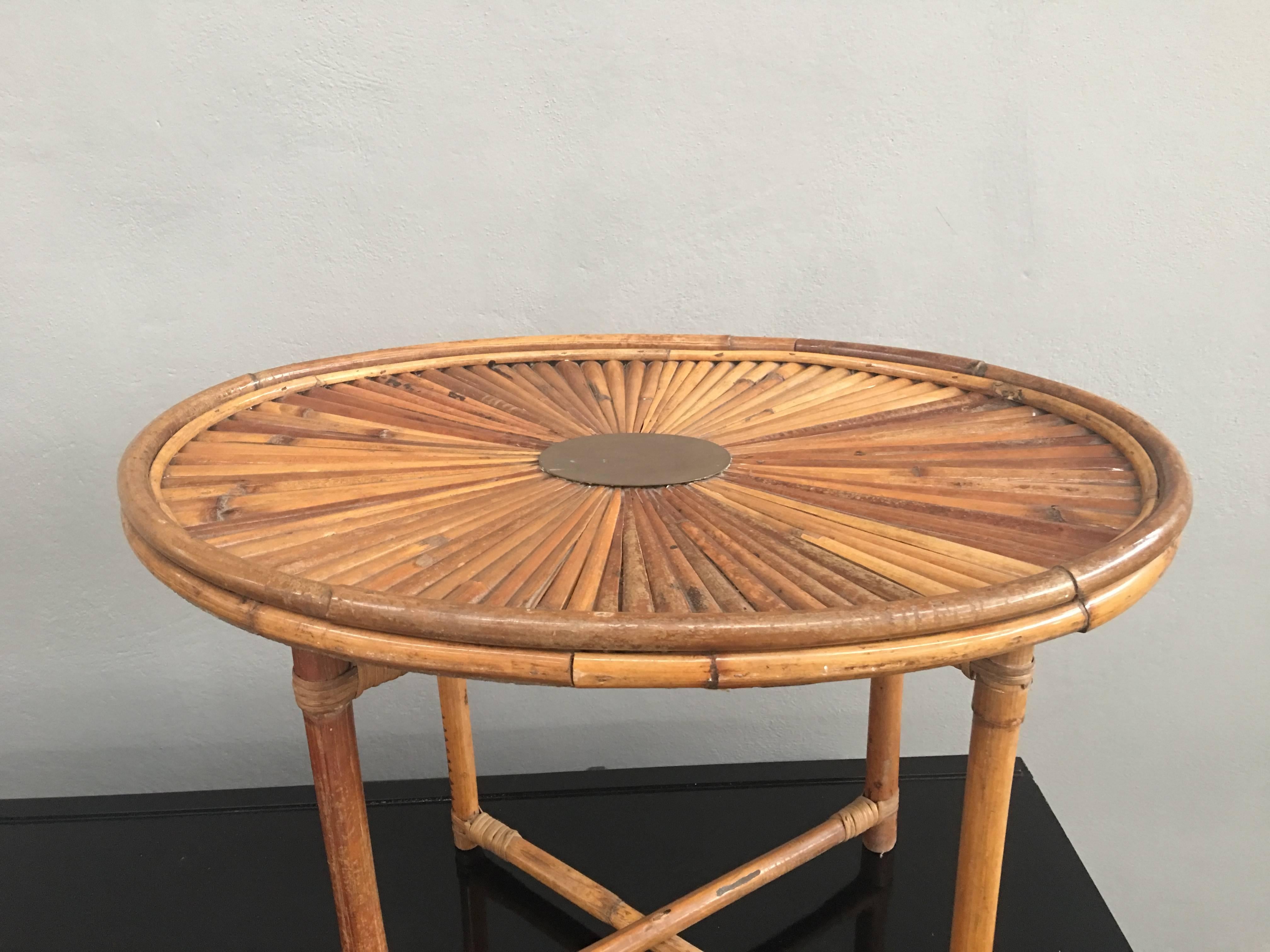 Oval bamboo and brass coffee table signed Gabriella Crespi.