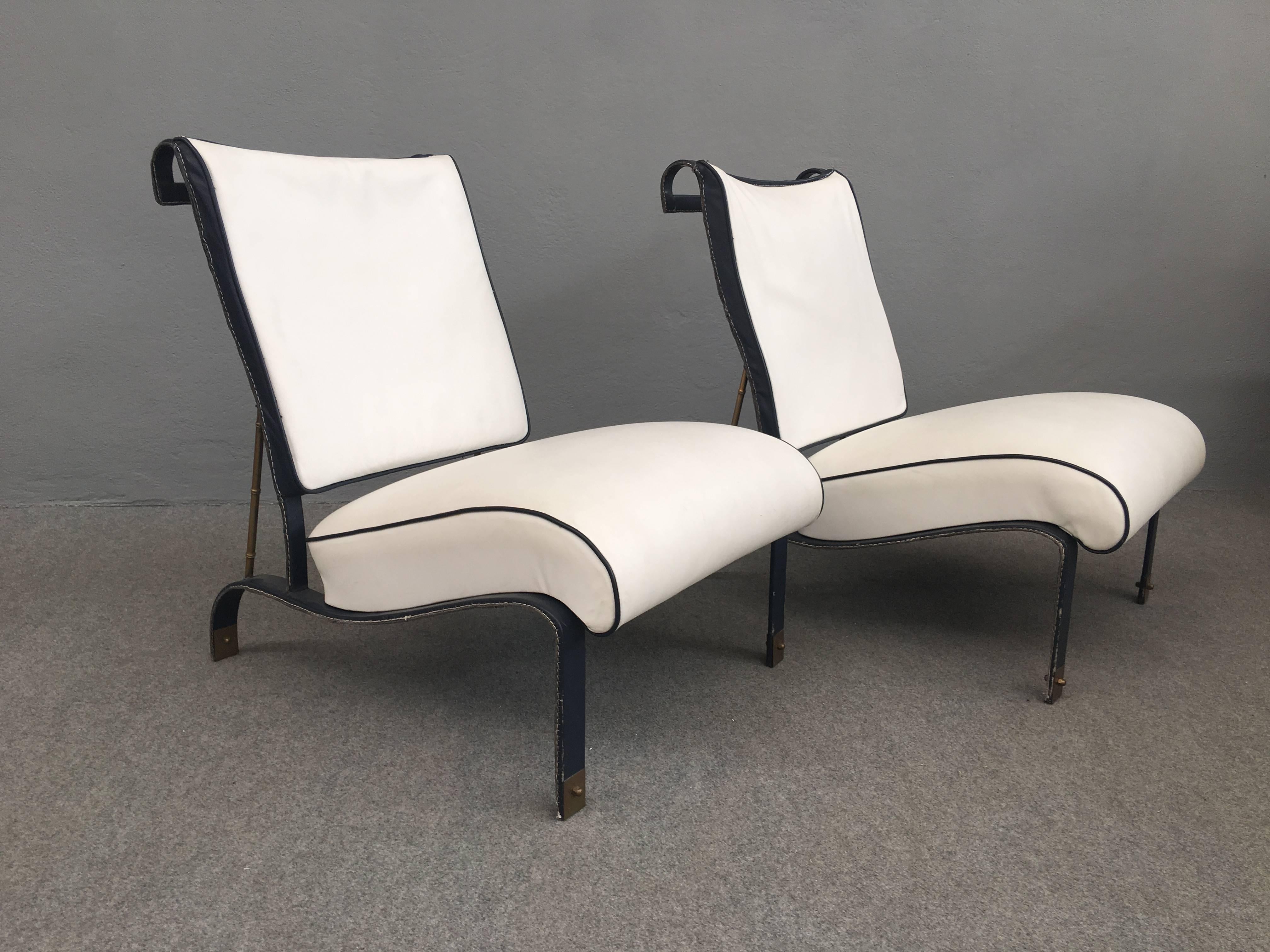 Rare pair of leather, metal and brass armchairs attributed to Jacques Adnet.
Provenance: Hermes store in Paris.