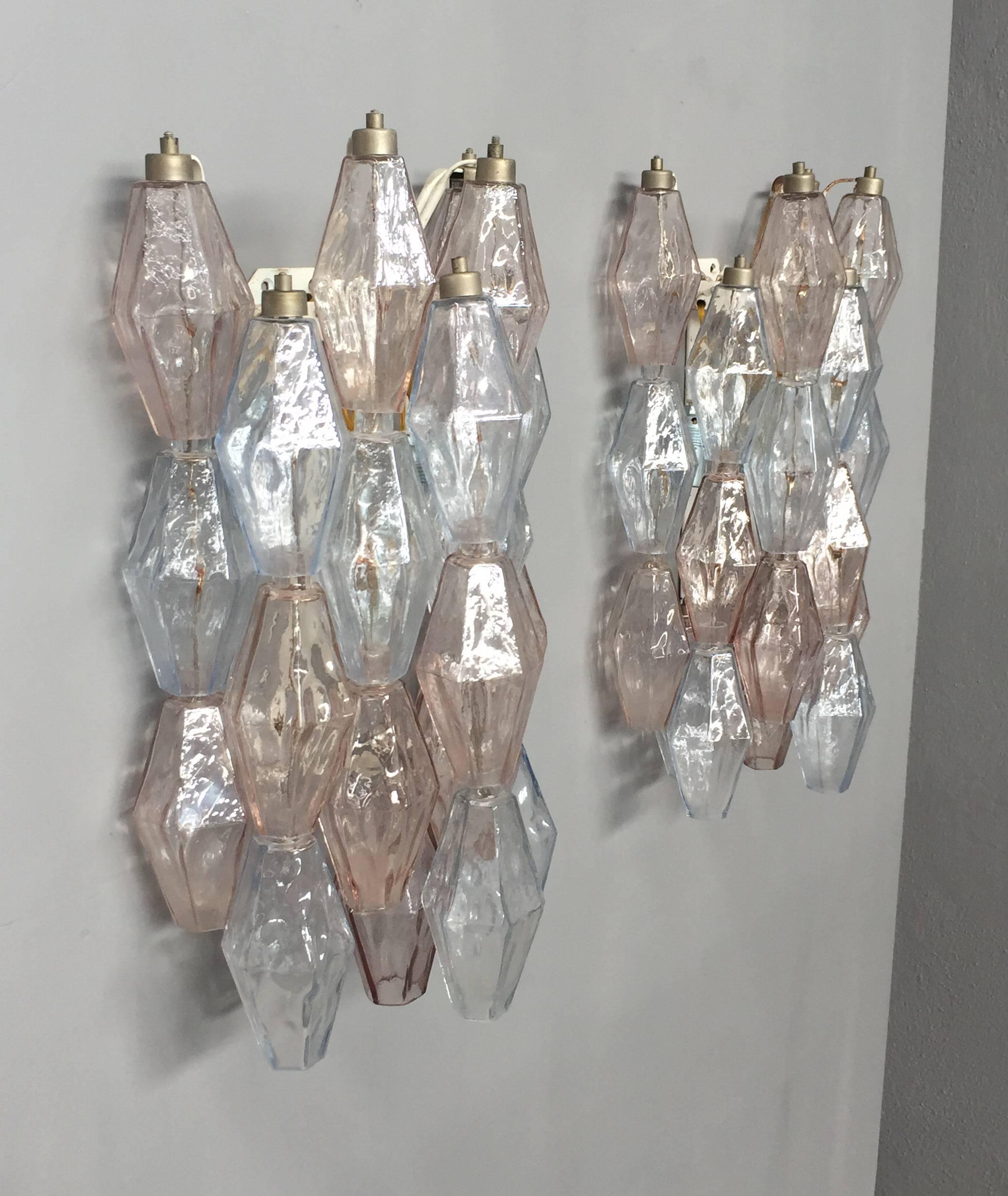 Clear, pink and light blue handblown Murano glass sconces.
Three lights each sconce.