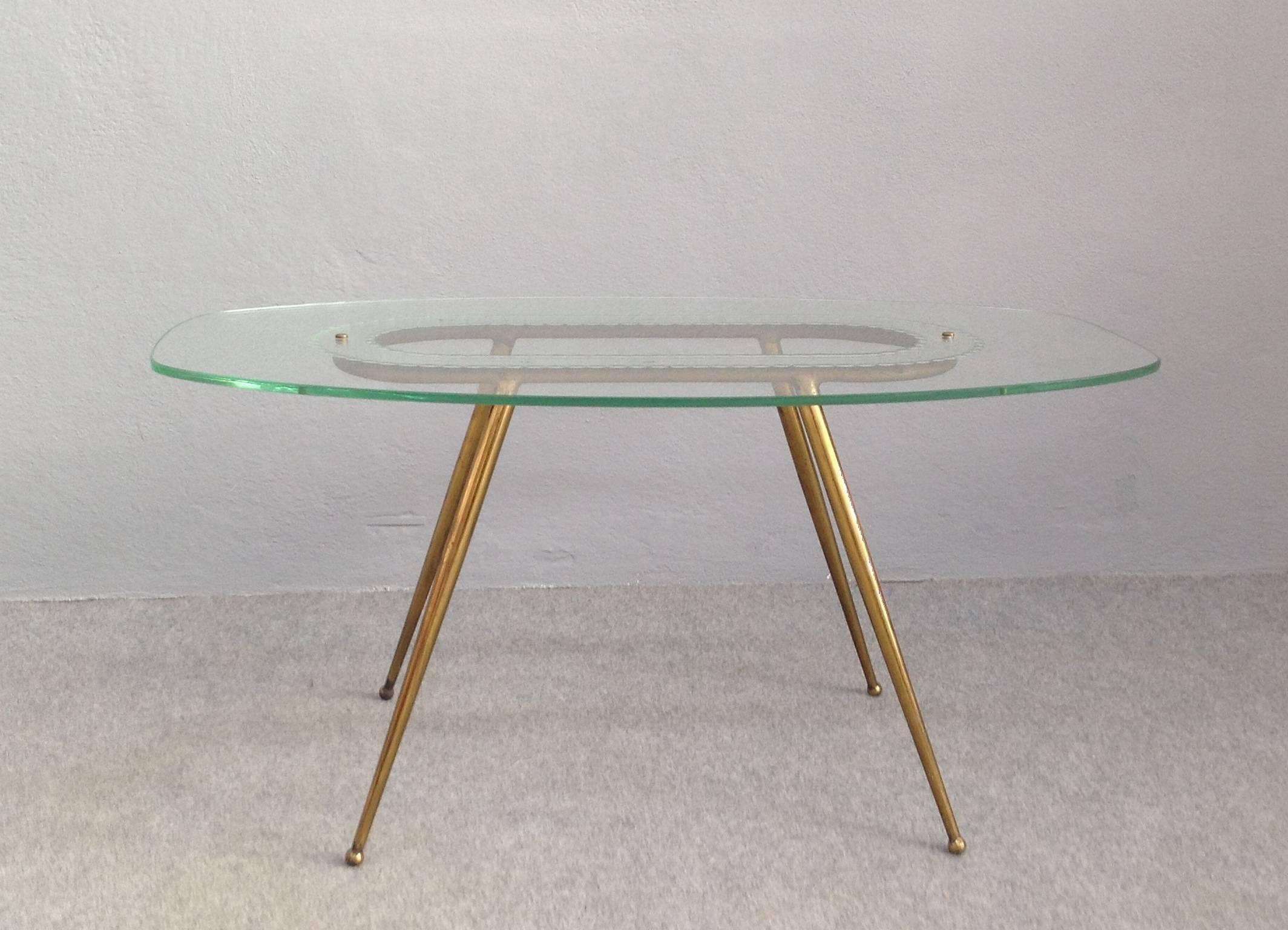 1950s glass and brass coffee table Fontana Arte style. Wonderful etched glass top, brass legs.