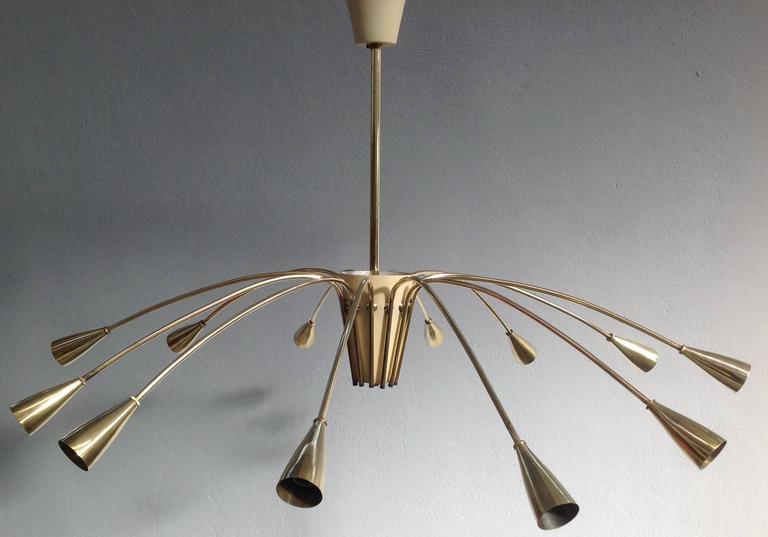 Brass Stilnovo twelvelights chandelier at 1stDibs