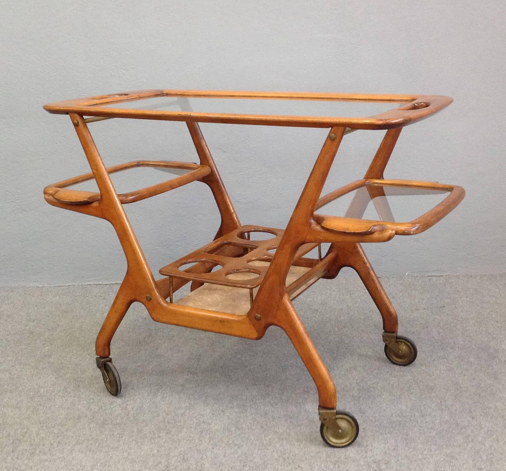 Very nice bar cart designed by Cesare Lacca.
Bottle holders, three glass shelves.