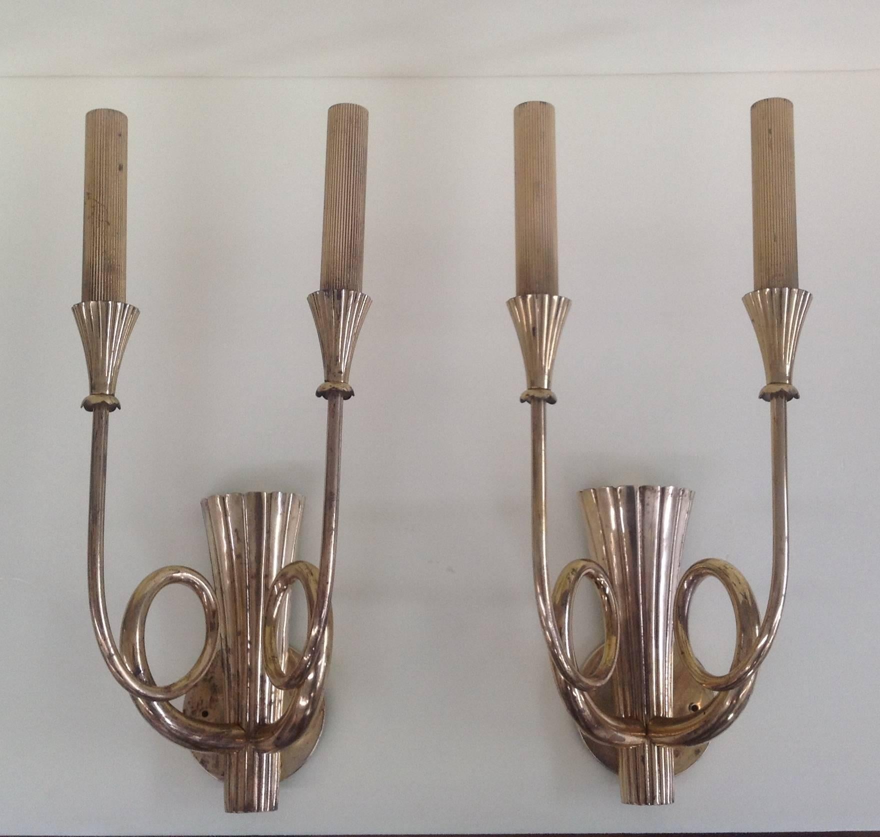Wonderful and huge pair of brass sconces.