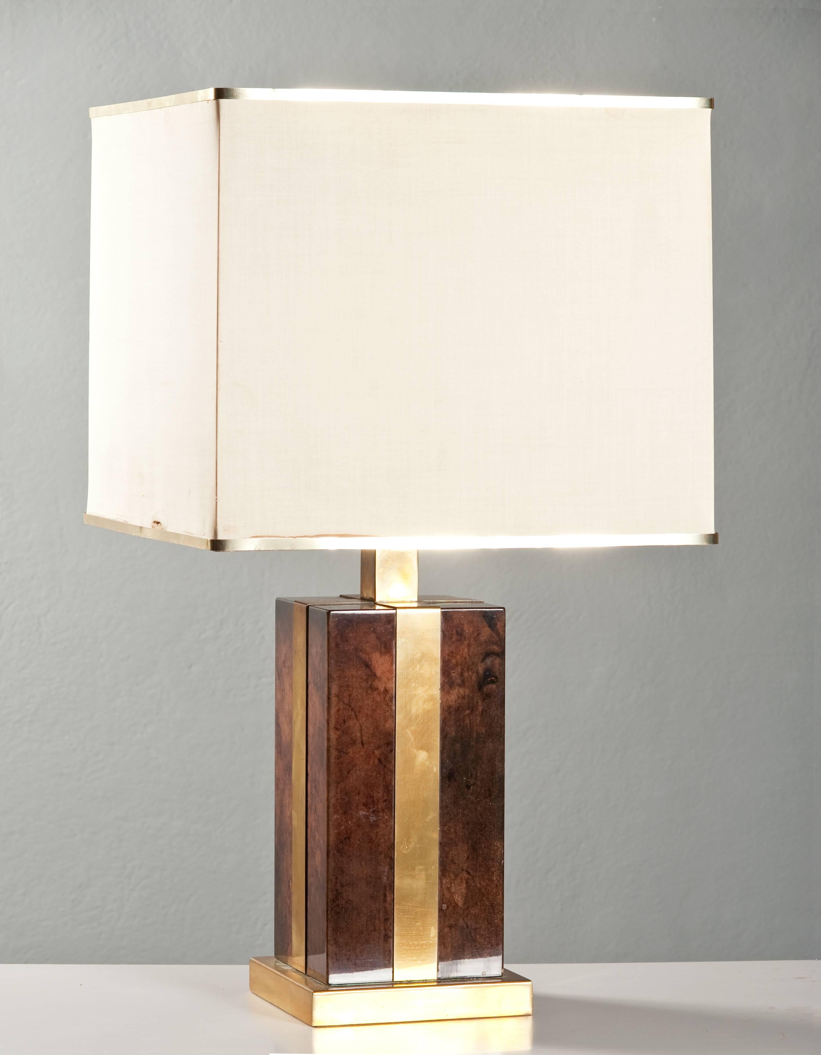 Stunning table lamp in brass and painted Lucite. The shade (vintage conditions) is in white fabric with brass frame.
