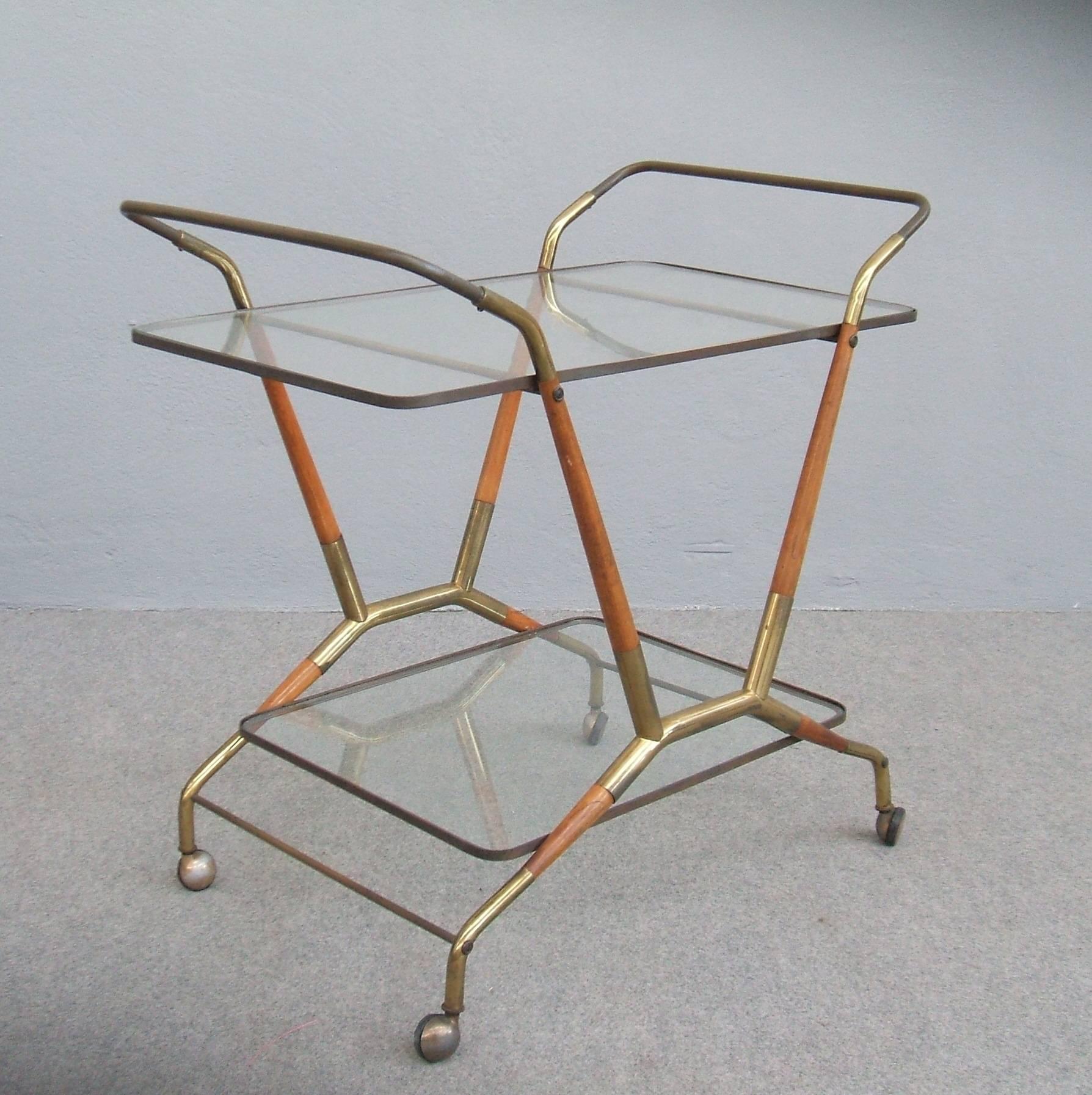 Wood and brass bar cart attributed to Cesare Lacca. Two tiers with original glass.