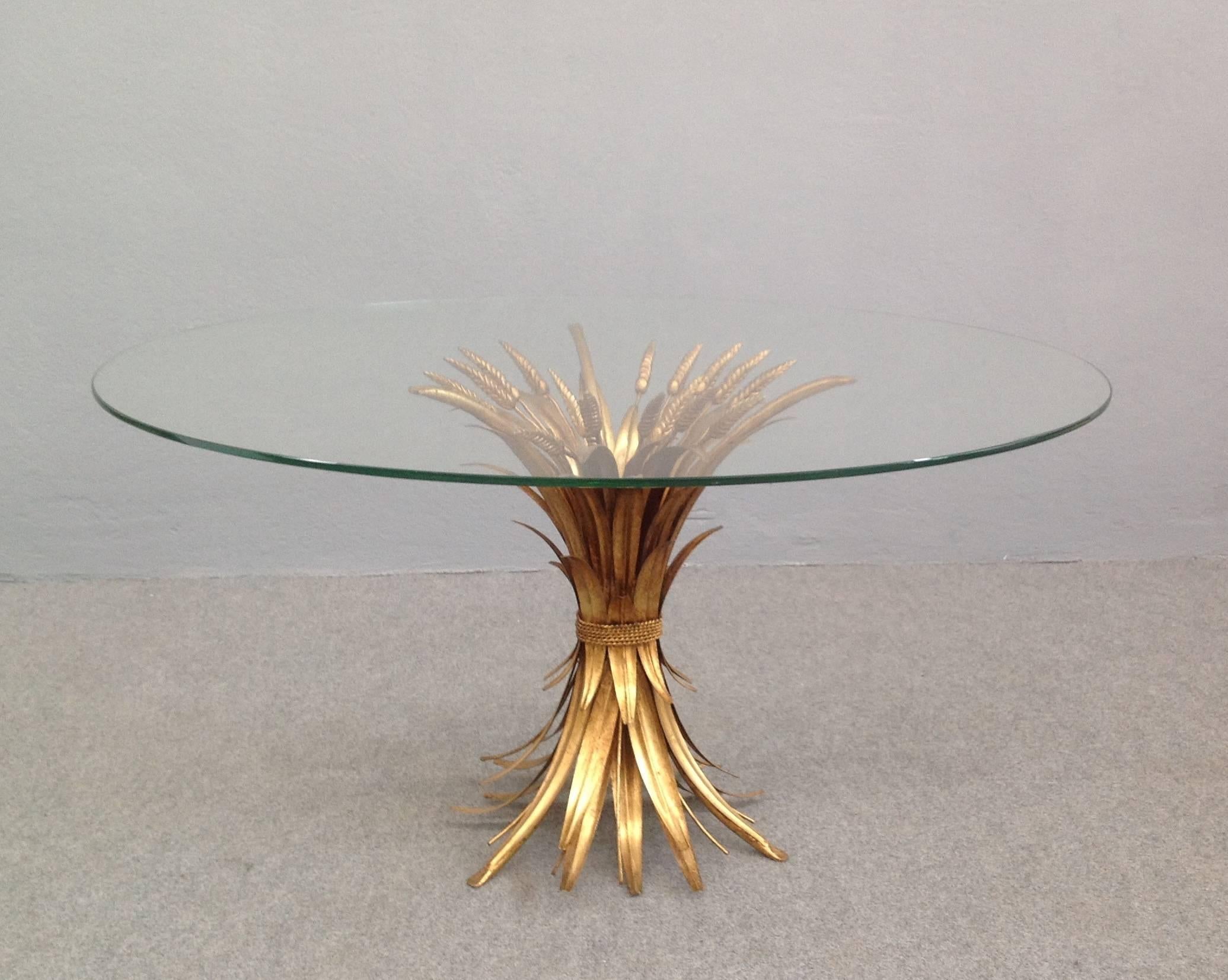 Very chic coffee table. Gilt iron base and round glass top.
 
