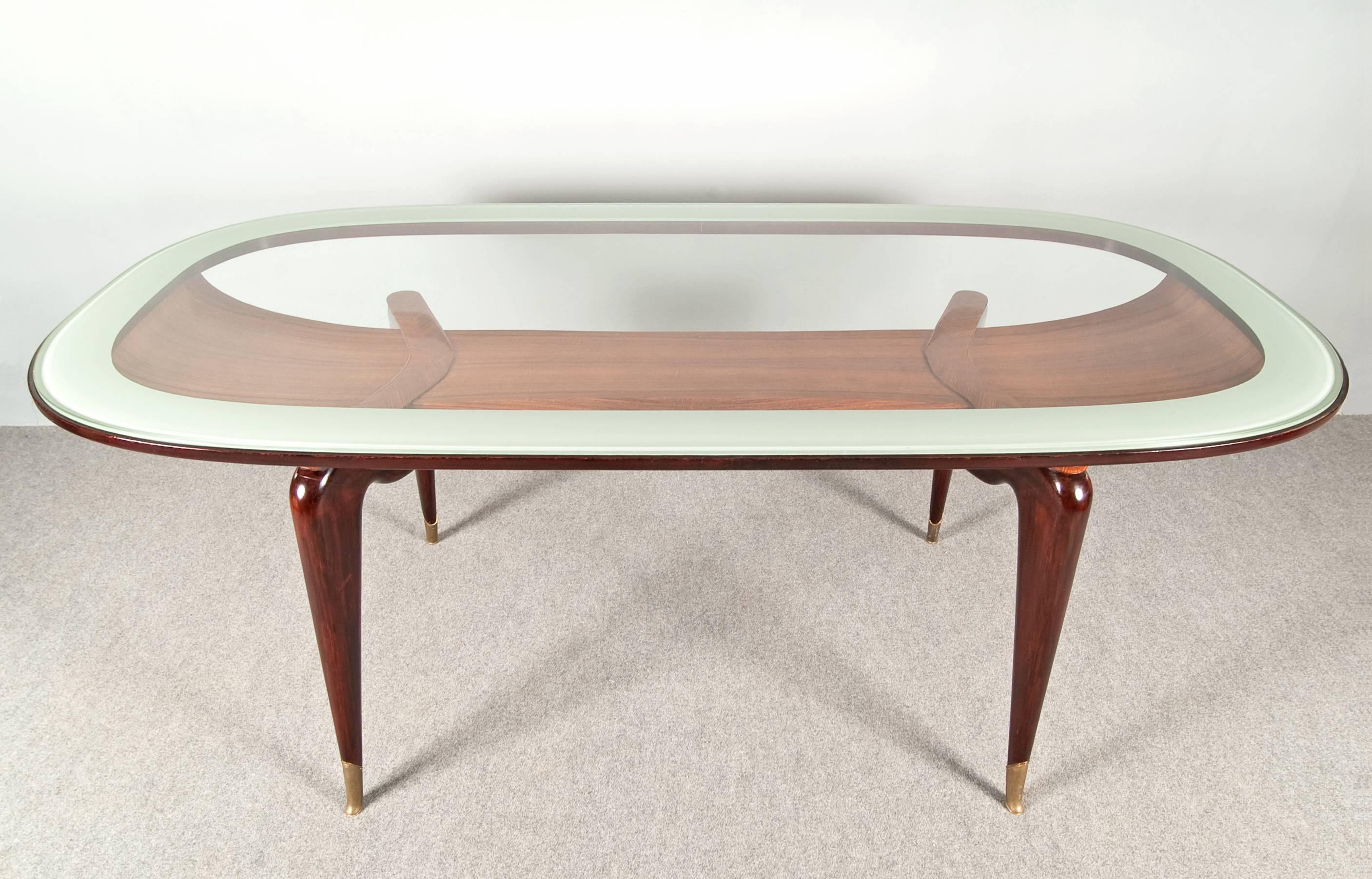 Really wonderful table attributed to Ico Parisi.
Elegant shape, under the glass top you can see an extraordinary ebanist work.
Brass details.