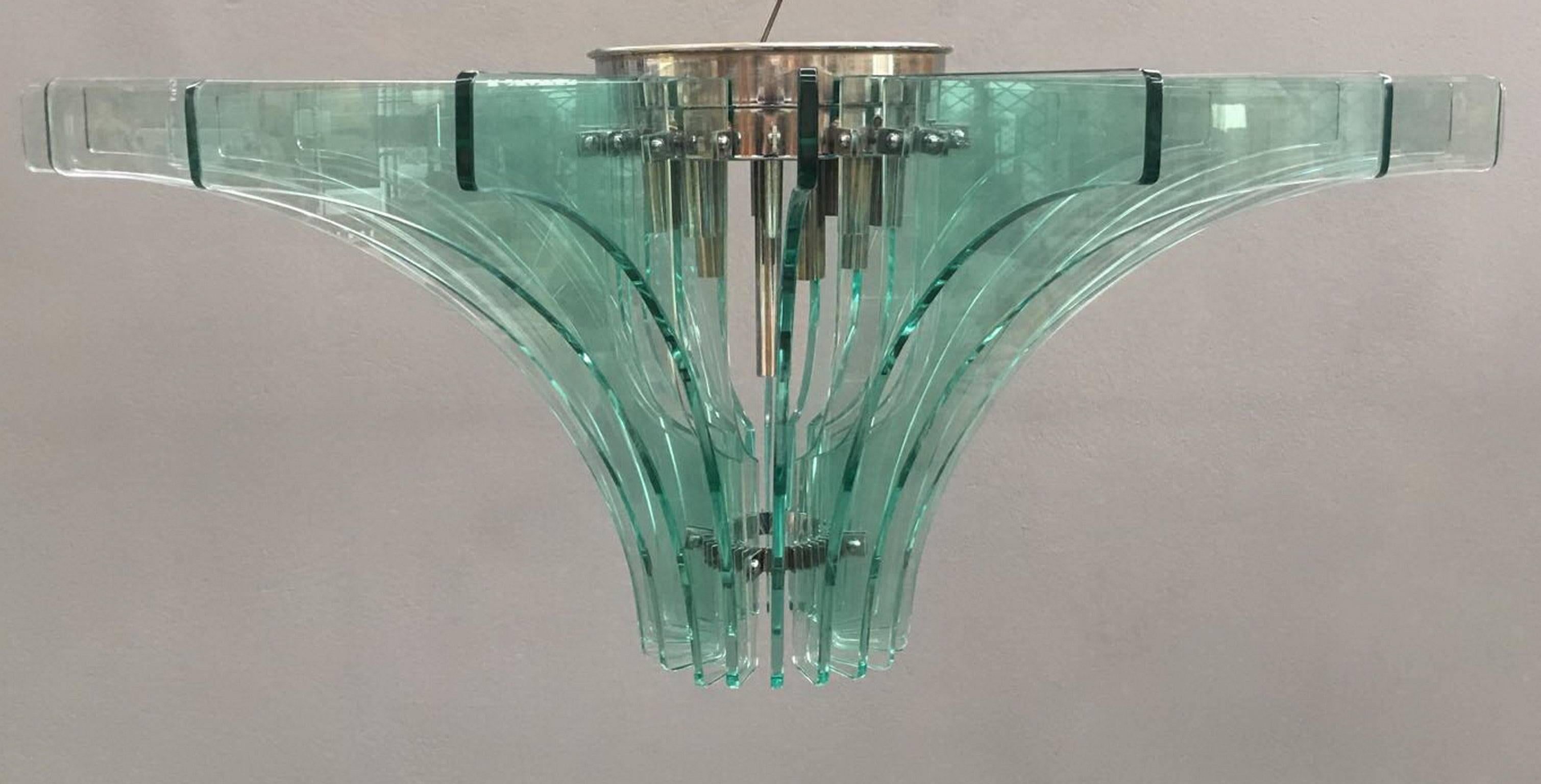 Huge pendant by G. Reggiori for Fontana Arte.
Mod 2056. Chrome brass and glass.