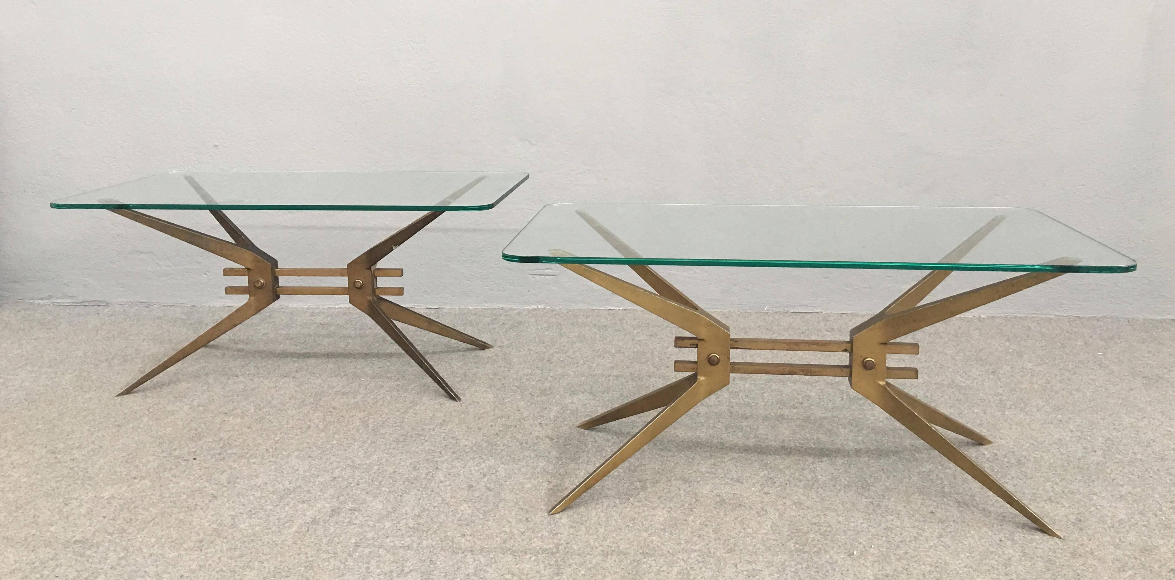 Rare pair of Italian 1950 brass and glass coffee table.
Sculptural brass base with original top glass.