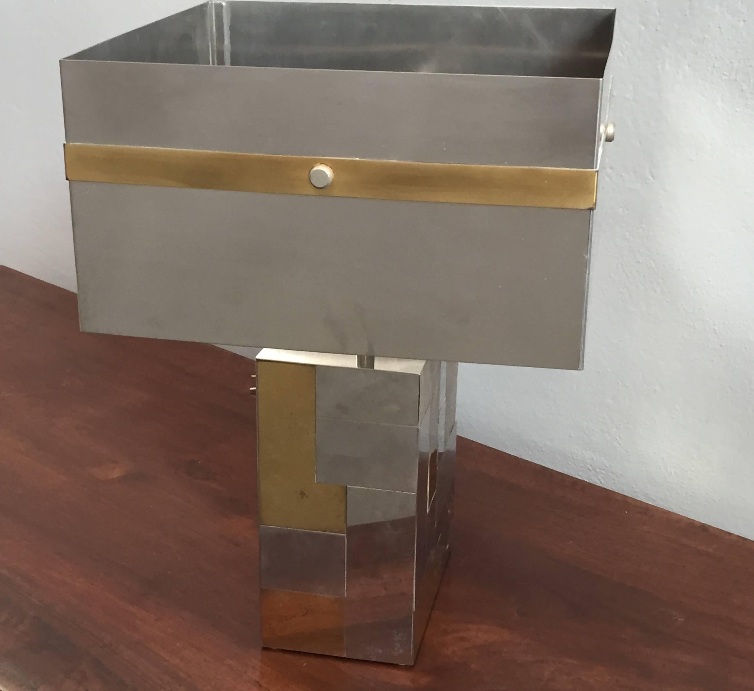 Cityscape table lamp attributed to Paul Evans,
chrome and brass base and shade.