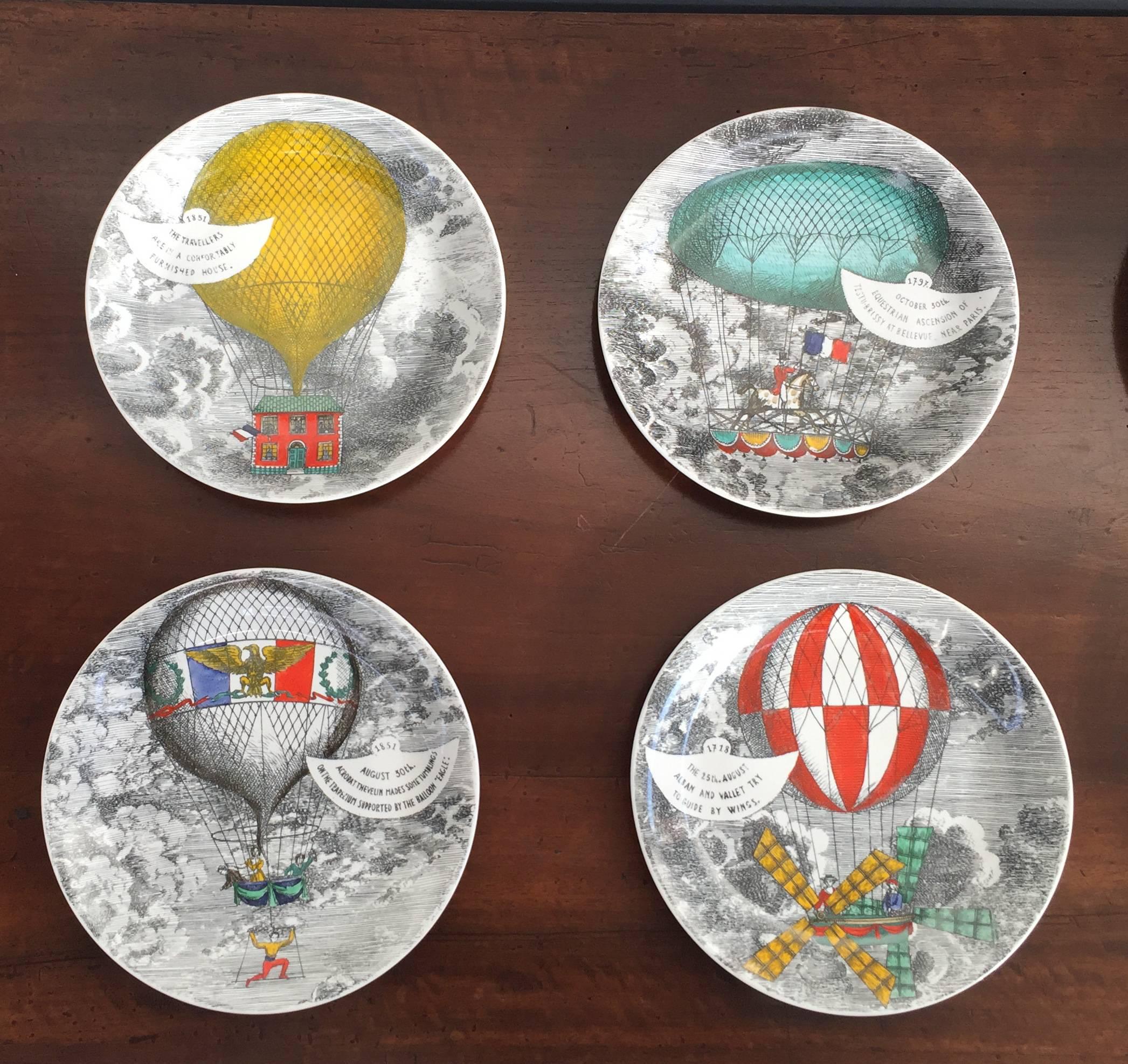 Chic set of eight porcelain Mongolfiere plates, on the back signed Mongolfiere Fornasetti Milano, 1955.
