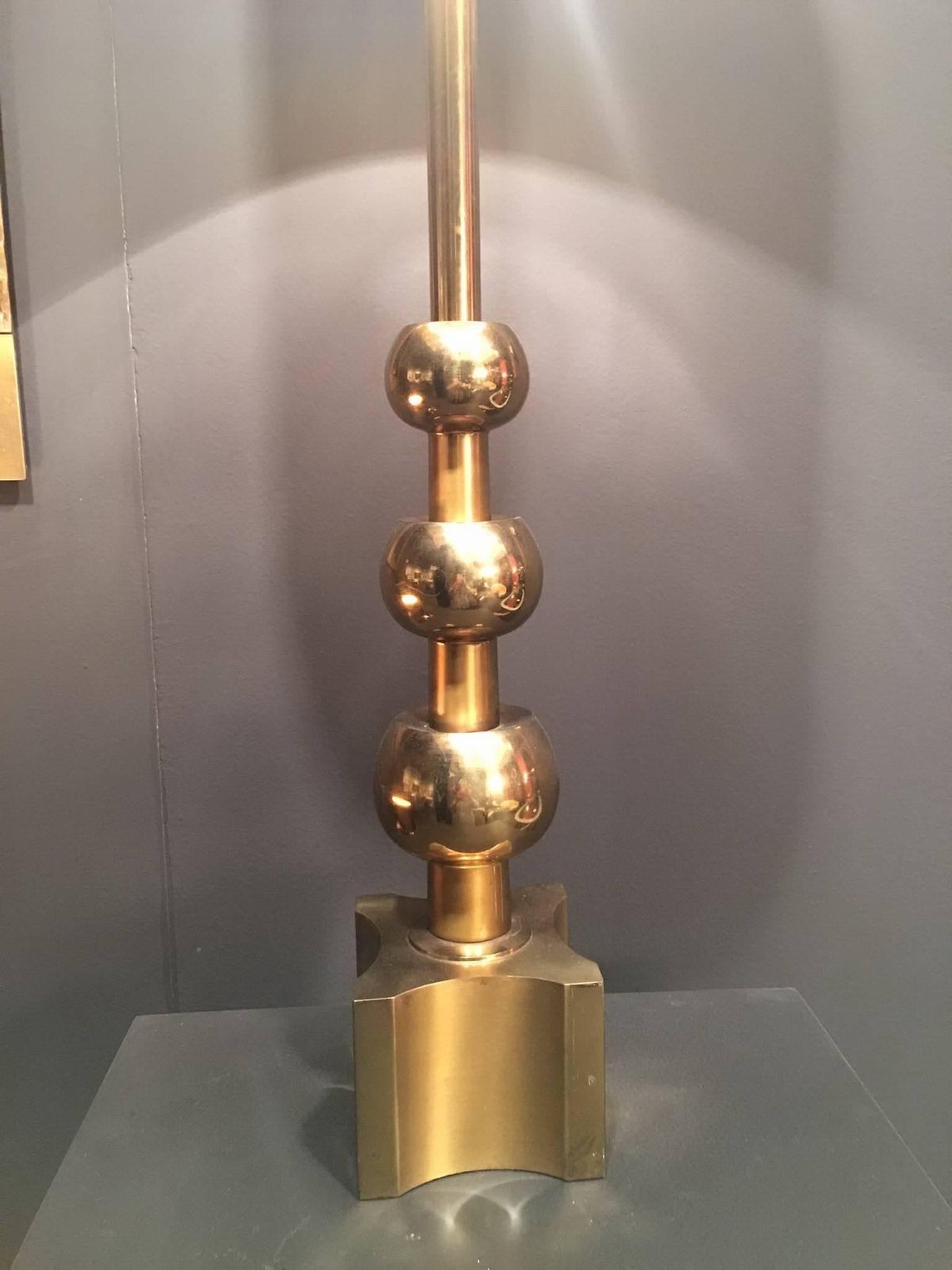 Huge pair of solid brass table lamps. Wonderful sculpted base.