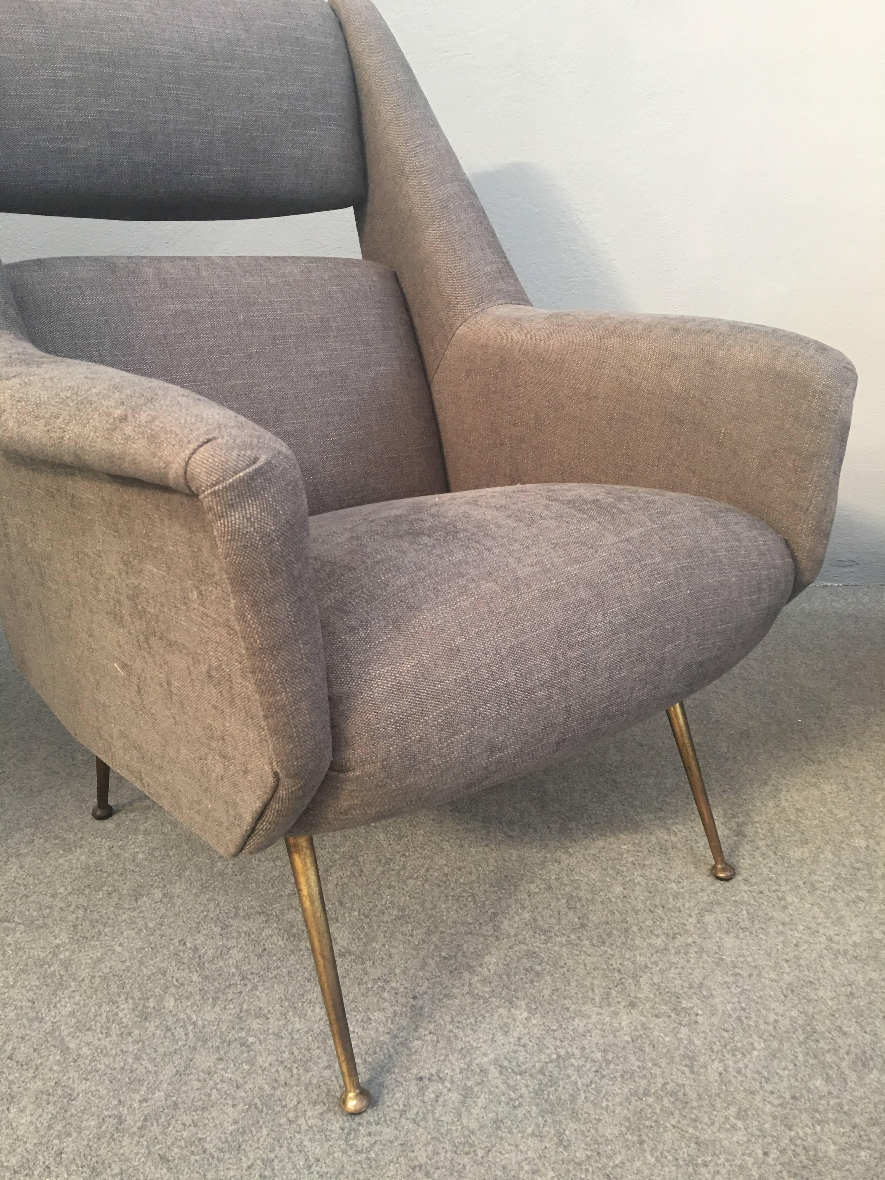Famous and stunning Carlo de Carli armchairs, solid brass legs.
Newly upholstered with grey linen.