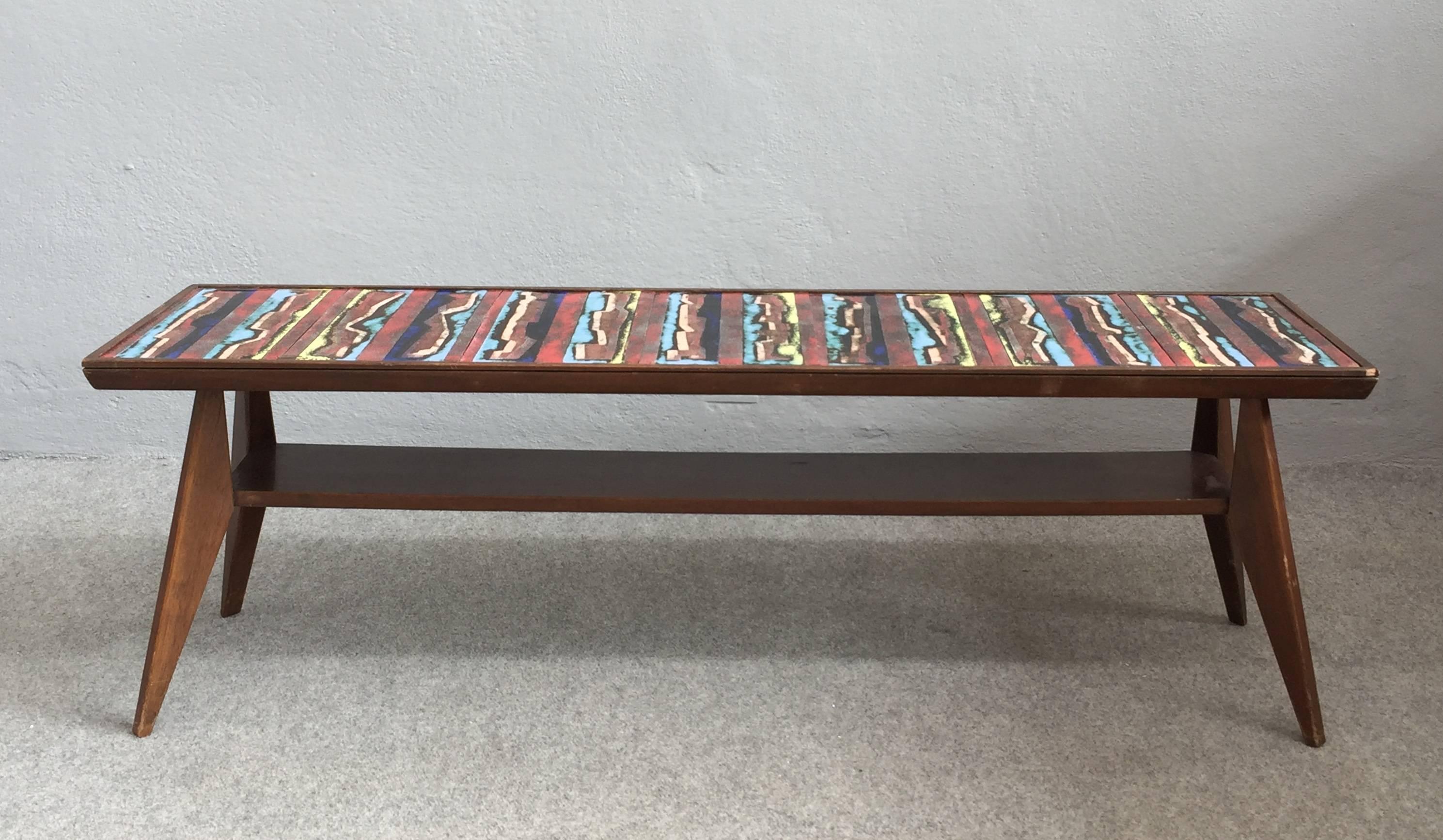 Wood base and enameled copper top coffee table.
Milan, 1950s.