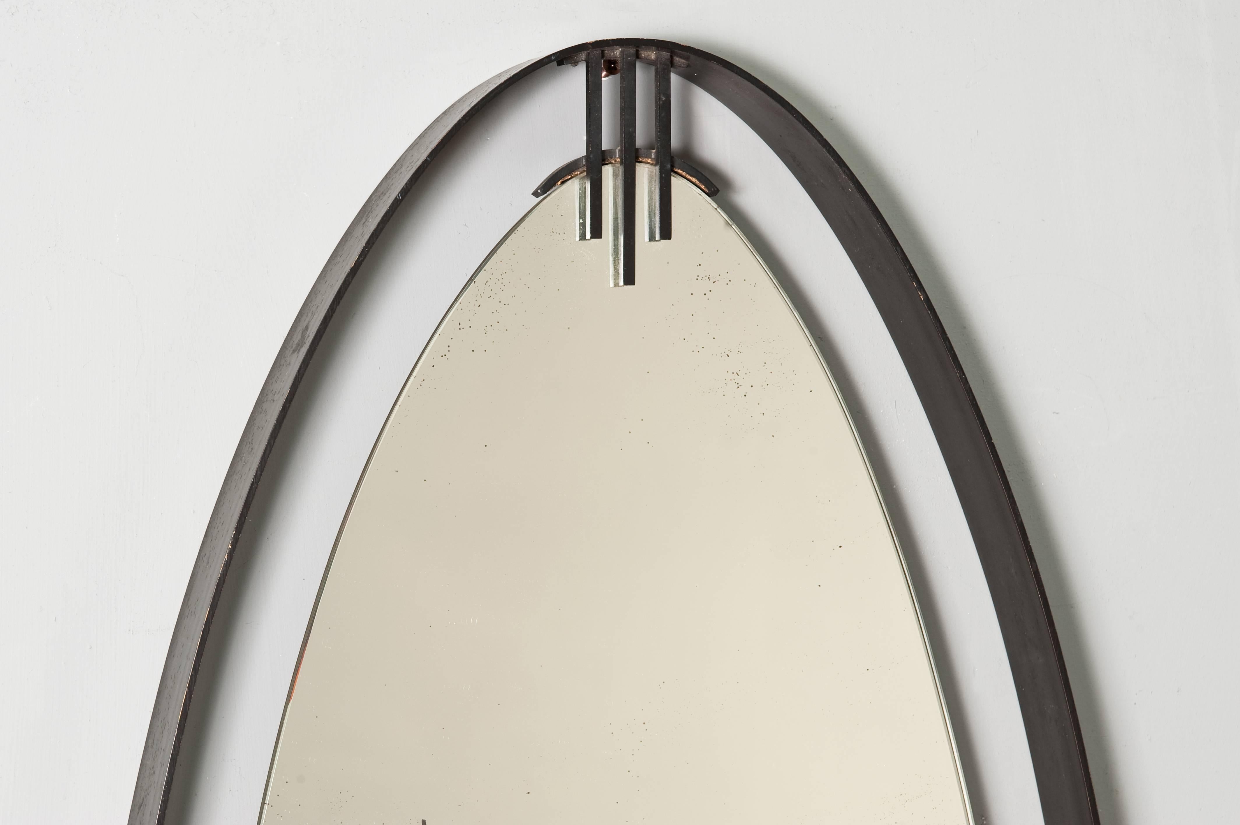 Black metal oval mirror by Santambrogio & De Berti.