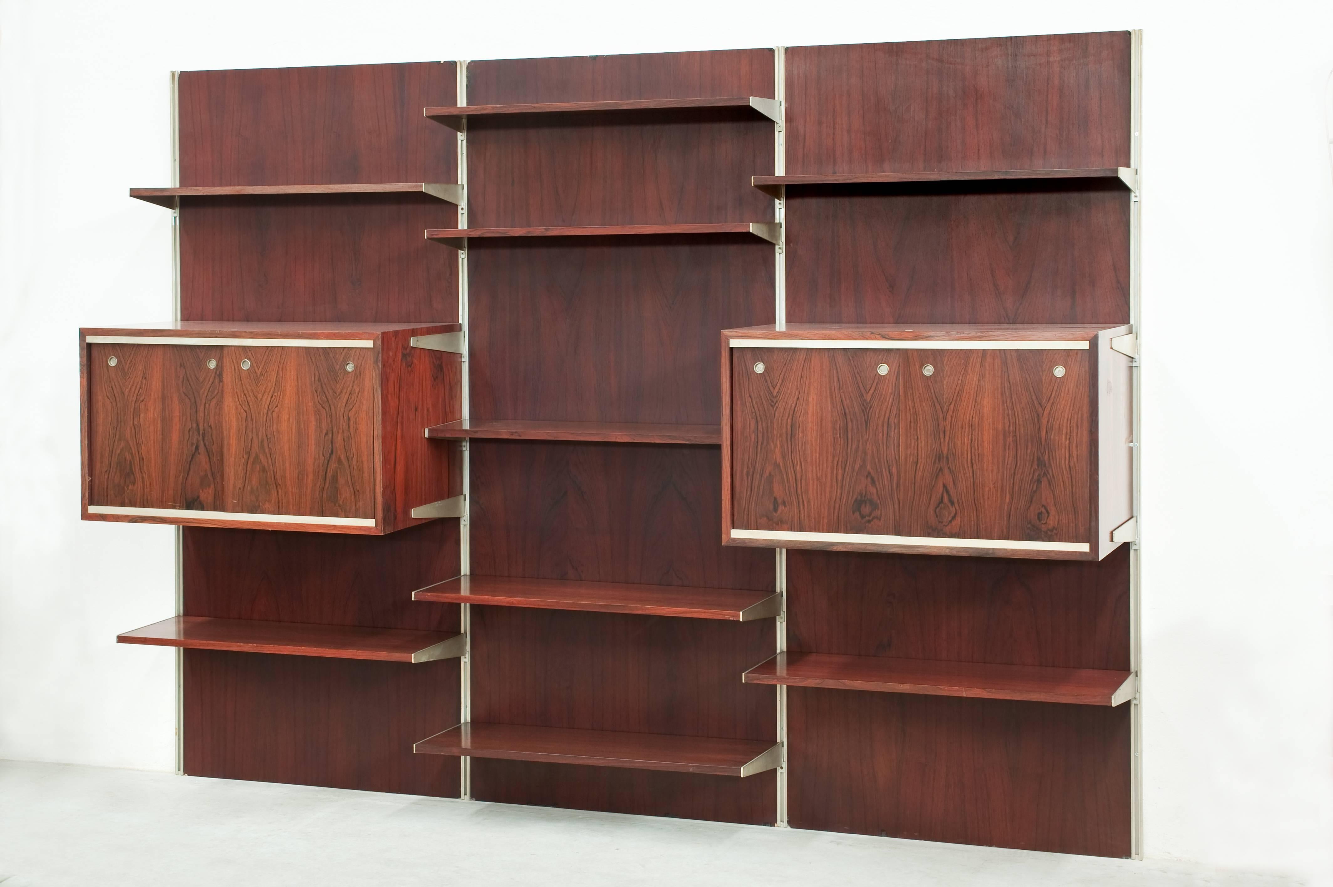 Very nice bookcase attributed to Kai Kristiansen.
Two cabinets with 2 doors each and 9 adjustable shelves.