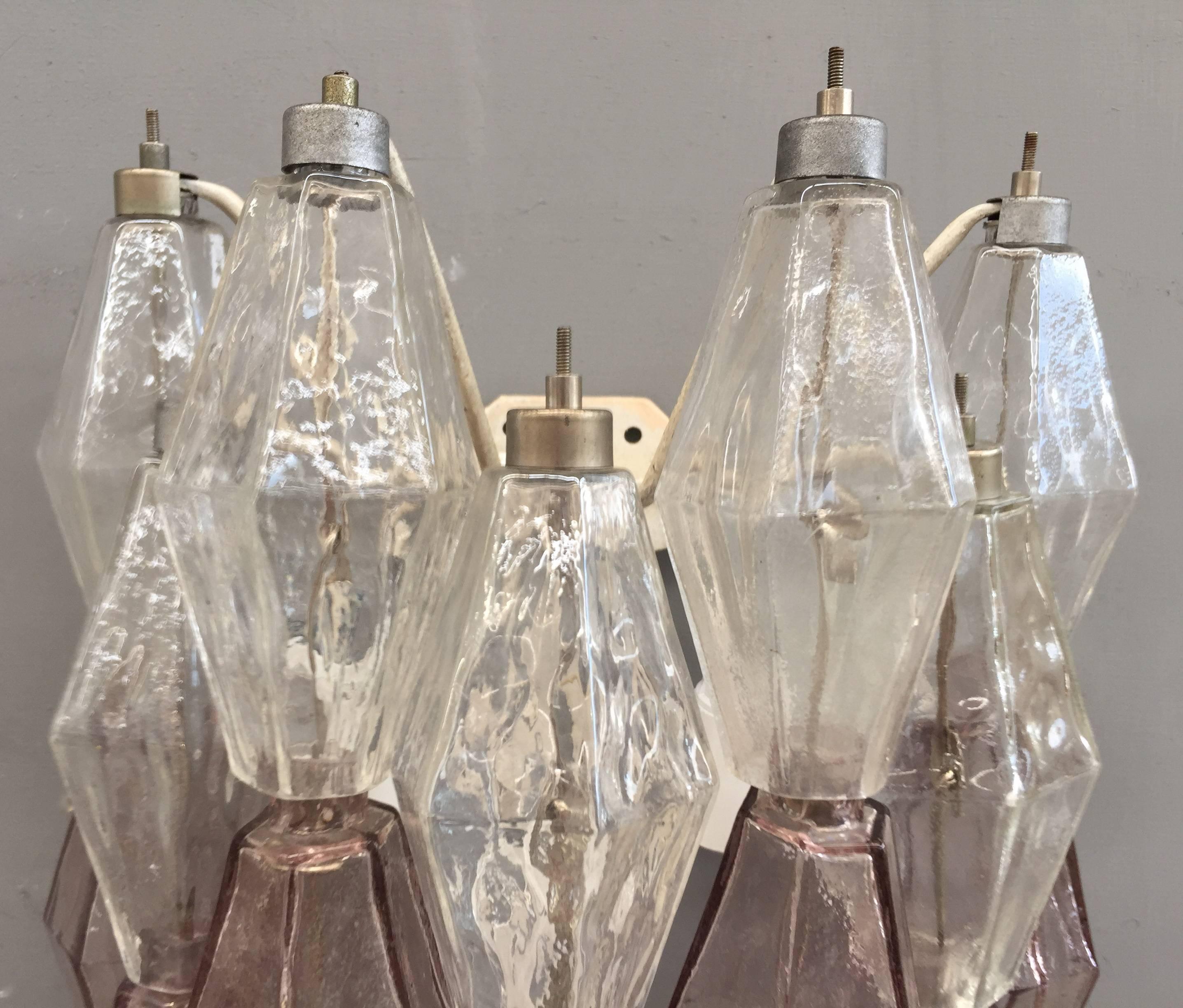 Glamorous set of three sconces attributed to Venini.
Clear and pink poliedri handblown glass.
Three lights each sconce.