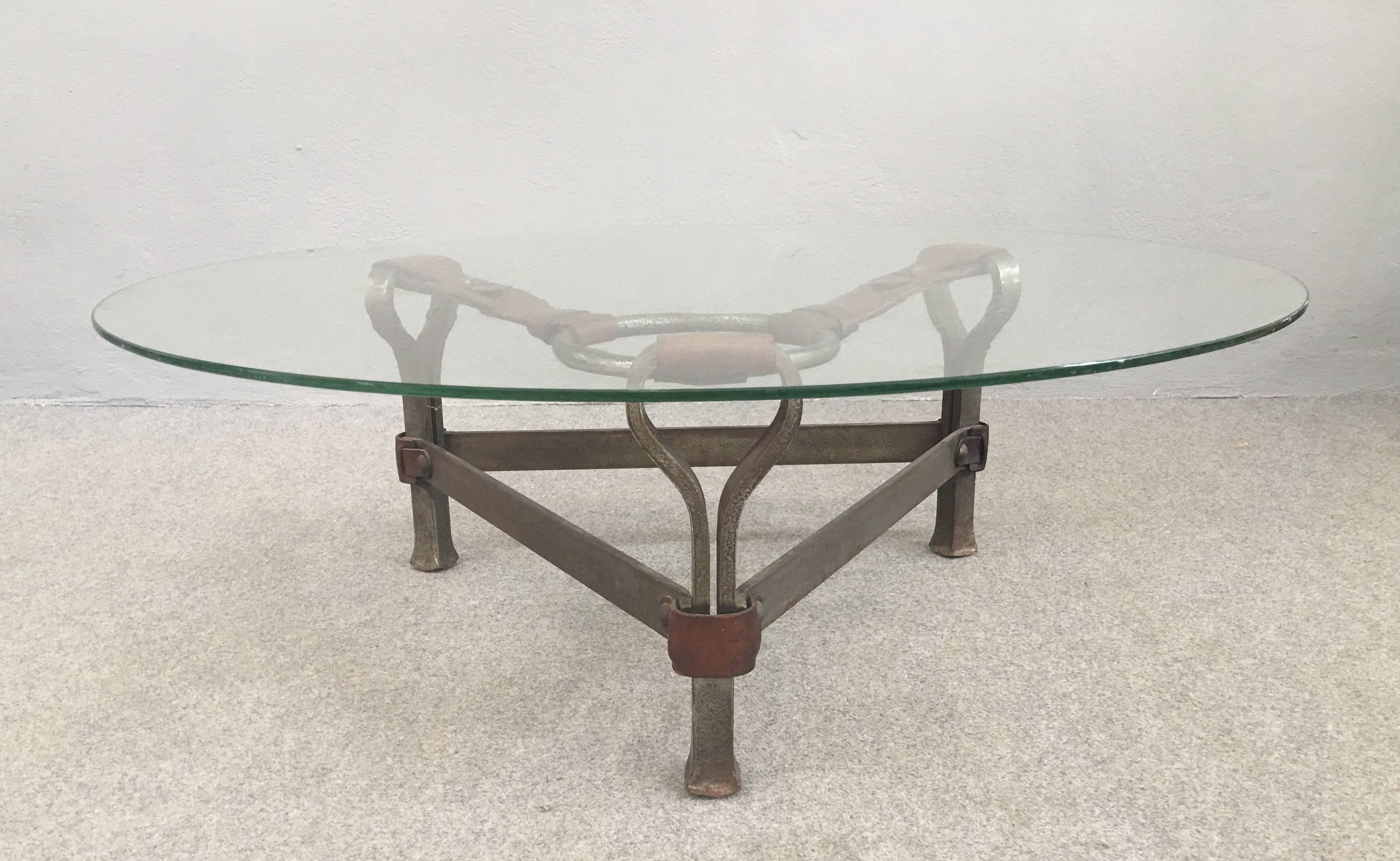 Iron and leather base with glass top coffee table attributed to Jacques Adnet.