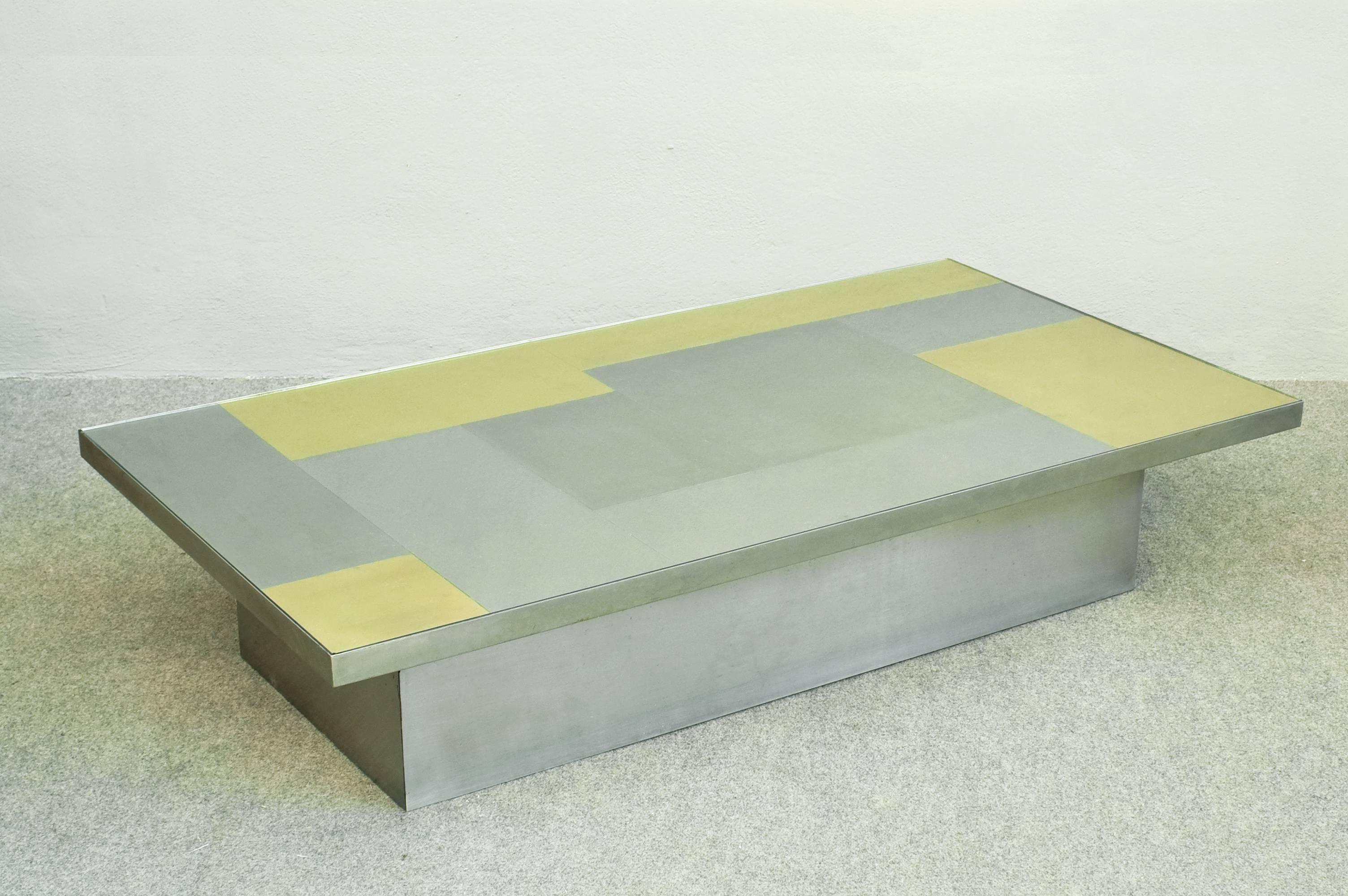 Huge and chic coffee table attributed to Romeo Rega.
Brushed stainless steel and brass top with glass.