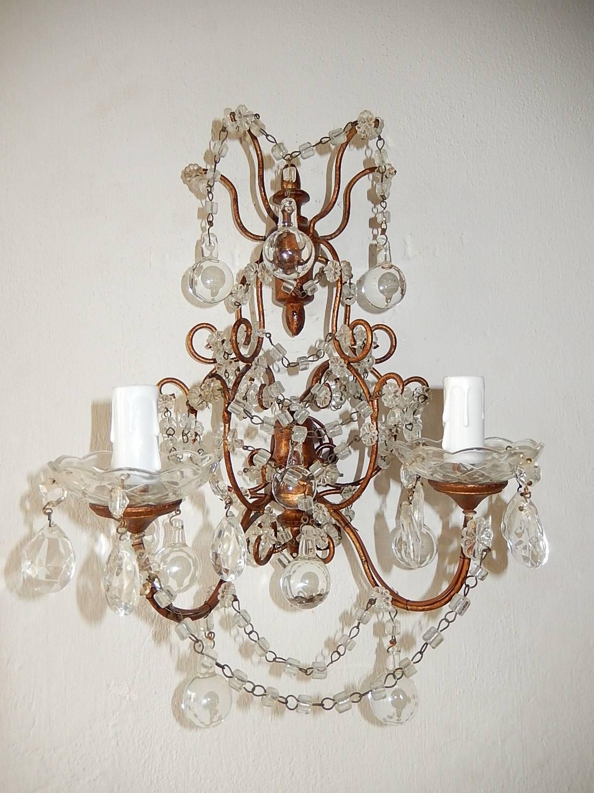 Housing two lights each. Crystal macaroni swags with clear Murano balls. Giltwood on back and under crystal bobeches. Re-wired and ready to hang. Free priority shipping from Italy.