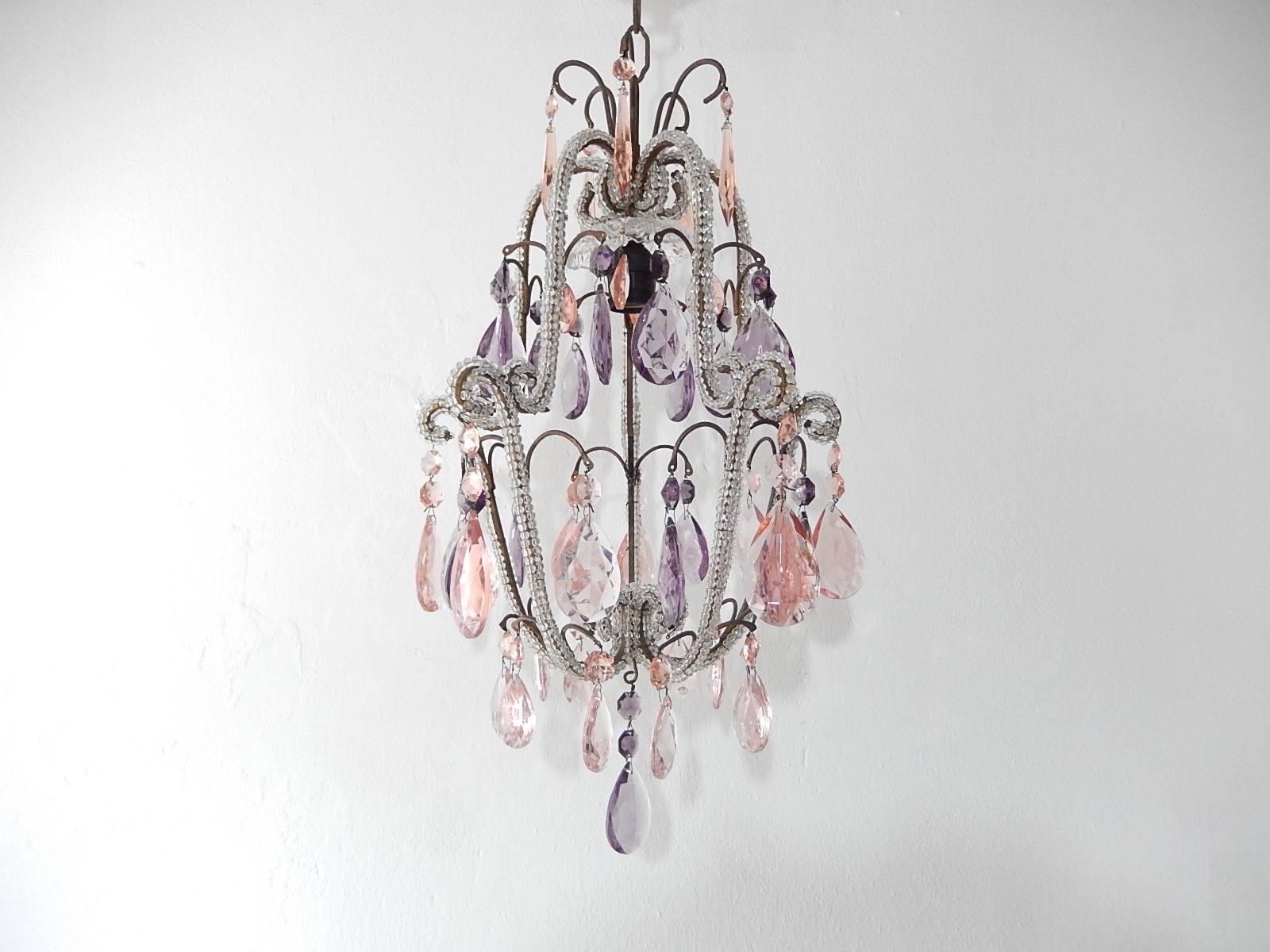 Housing one-light under crystal bobeche. Beaded throughout. Adorning pink and purple crystal prisms. Adding another 9 inches of original chain and canopy. Re-wired and ready to hang. Free priority shipping from Italy.