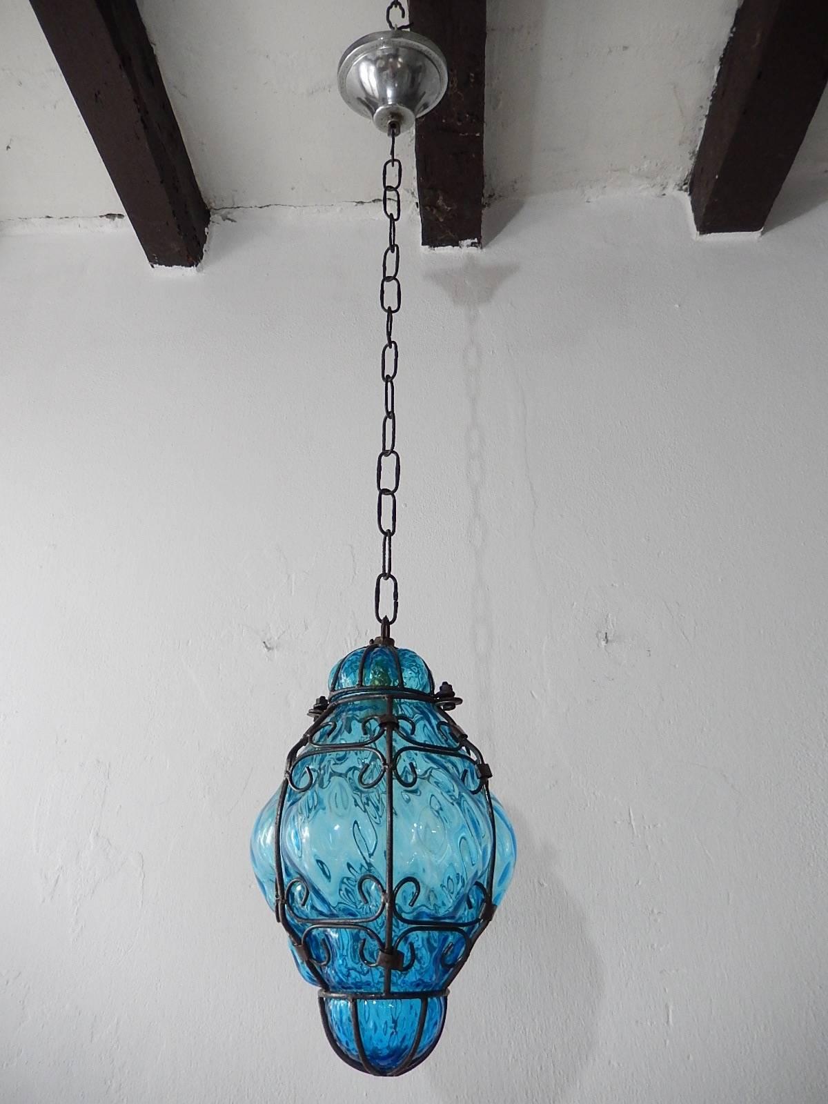 Housing one light. Rare aqua Murano blown glass. Great craftsmanship. Re-wired and ready to hang. Free priority shipping from Italy. Adding another 23 inches of original chain and canopy.