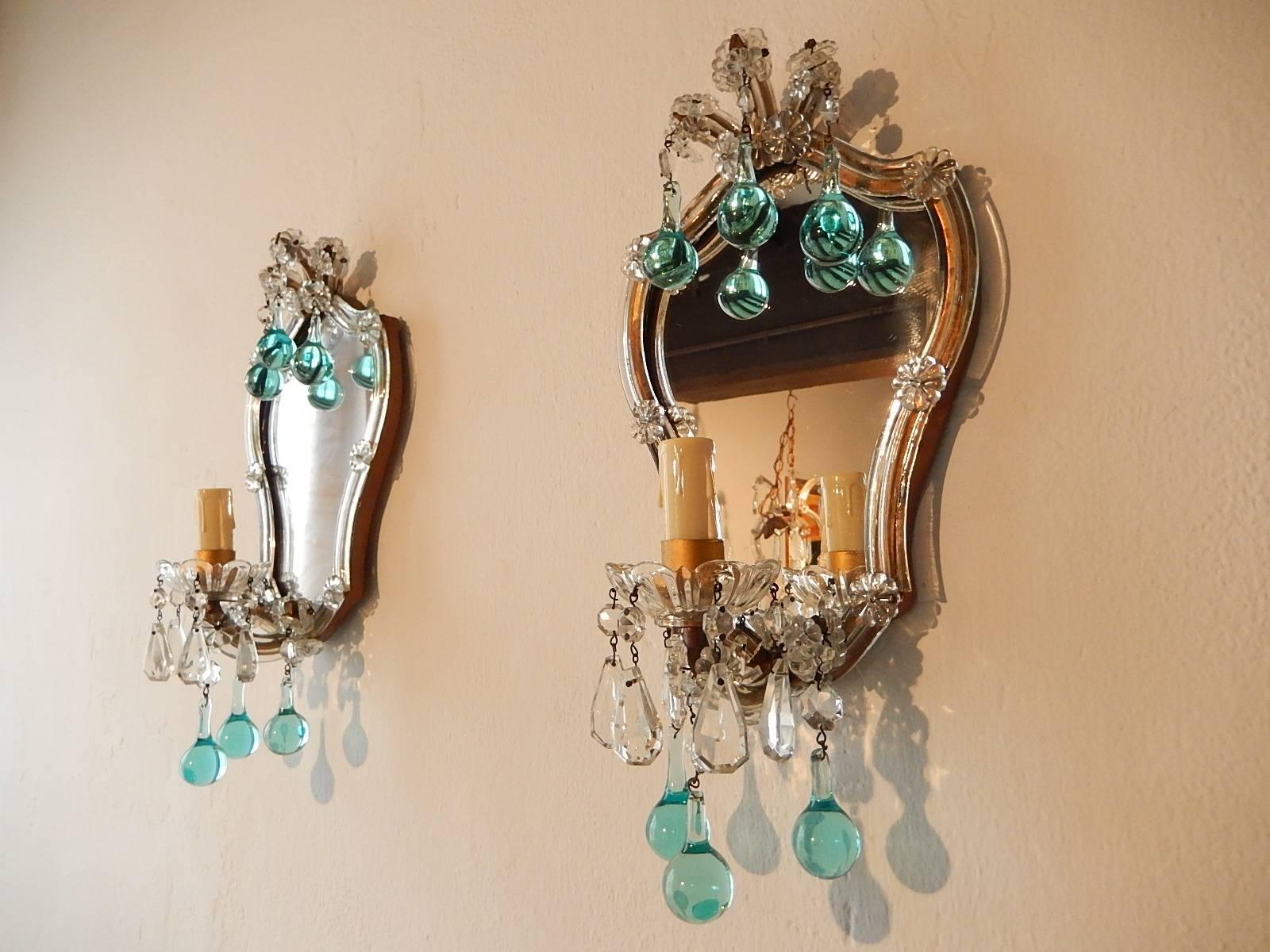 Housing one light each sitting in crystal bobeches, just dripping with crystal prisms. Rewired and ready to hang! Gilt metal with clear Murano glass covering with florets and beads. Mirrors in great condition, some silver missing. Adorning six rare