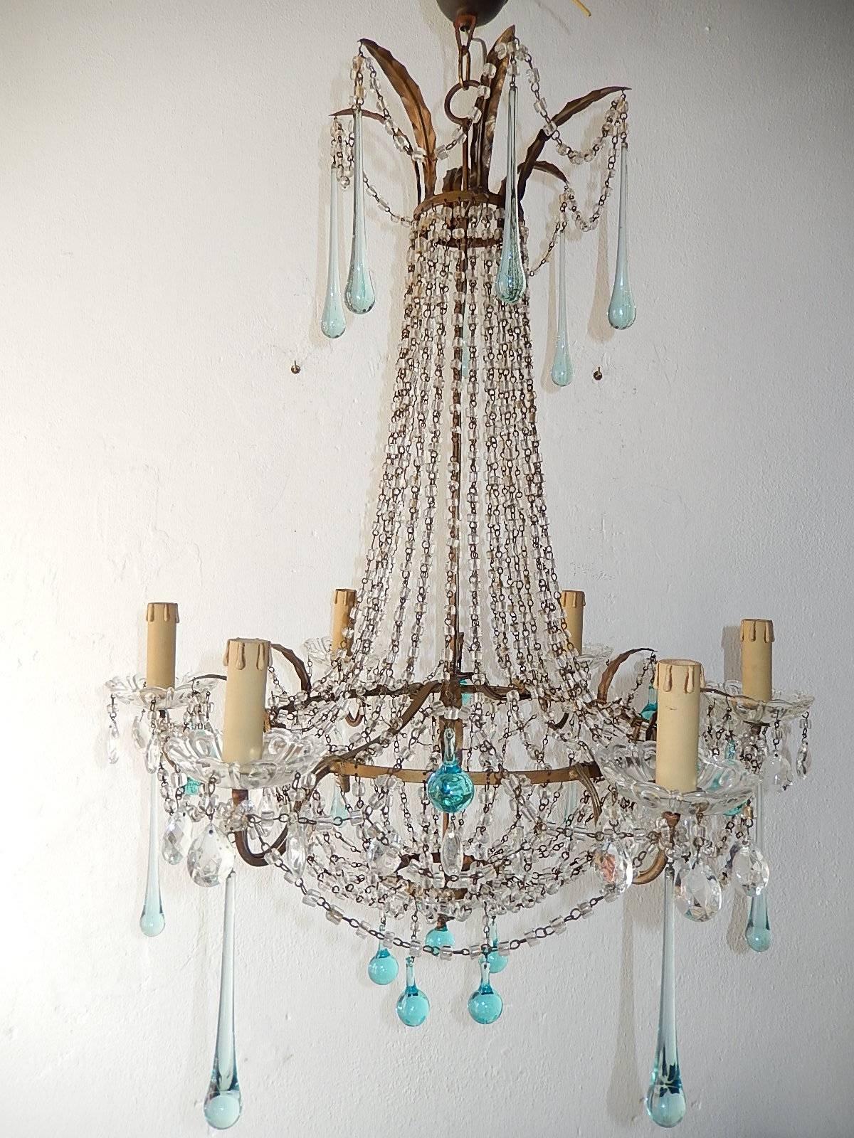 Housing six lights, sitting in crystal bobeches dripping with crystal prisms. Swags of macaroni beads and aqua Murano drops throughout. Rewired and ready to hang. Adding another 4 inches of canopy. Free priority shipping from Italy.