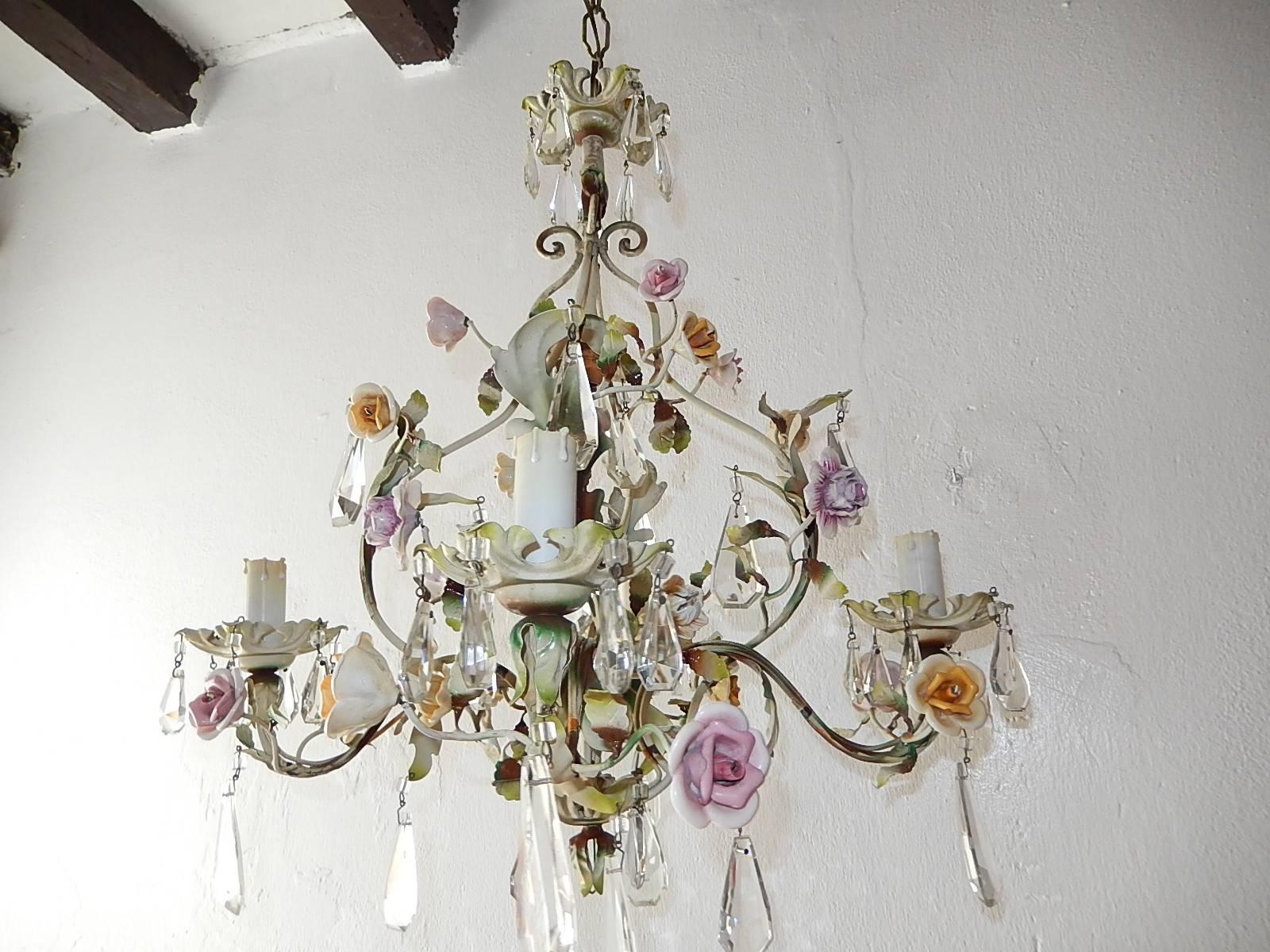 Housing five-light, four encircling and one in top. Rewired and ready to hang. Porcelain handmade flowers in all shapes, colors and sizes. All in great shape. Also adorning rare shape 