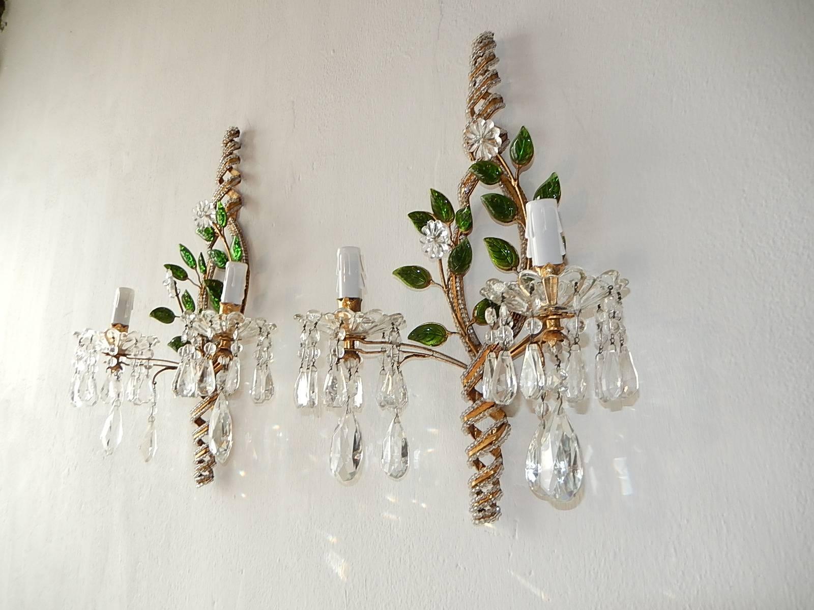 Housing two lights each, sitting in crystal bobeches dripping with vintage crystal prisms. Beaded with green glass leaves over gold gilt metal. Adorning two crystal flowers and beaded helix. Re-wired and ready to hang. Free priority shipping from