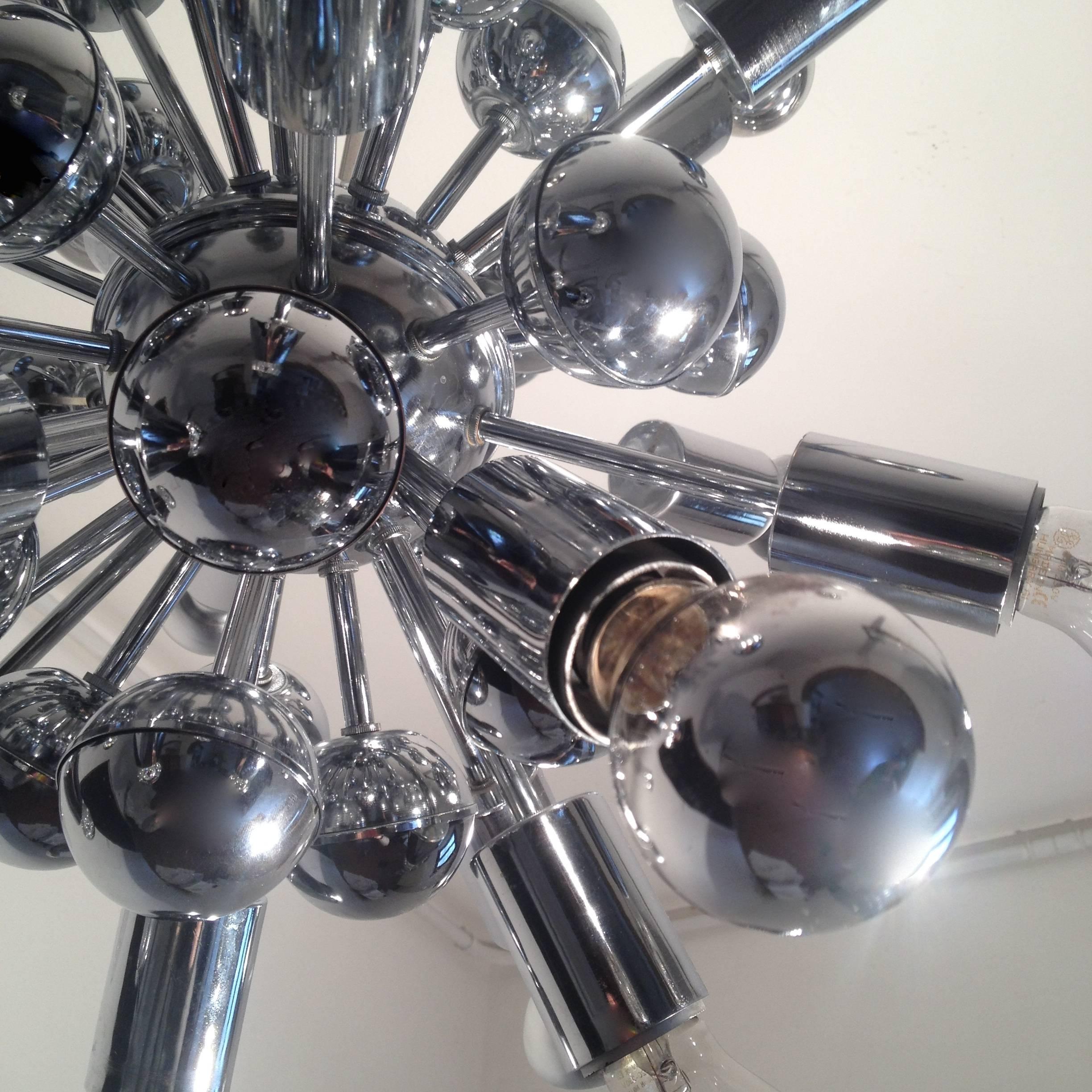 Authentic articulate sputnik chandelier in chrome with centre sphere and multiple arms.
Very sculptural and expressive.
 