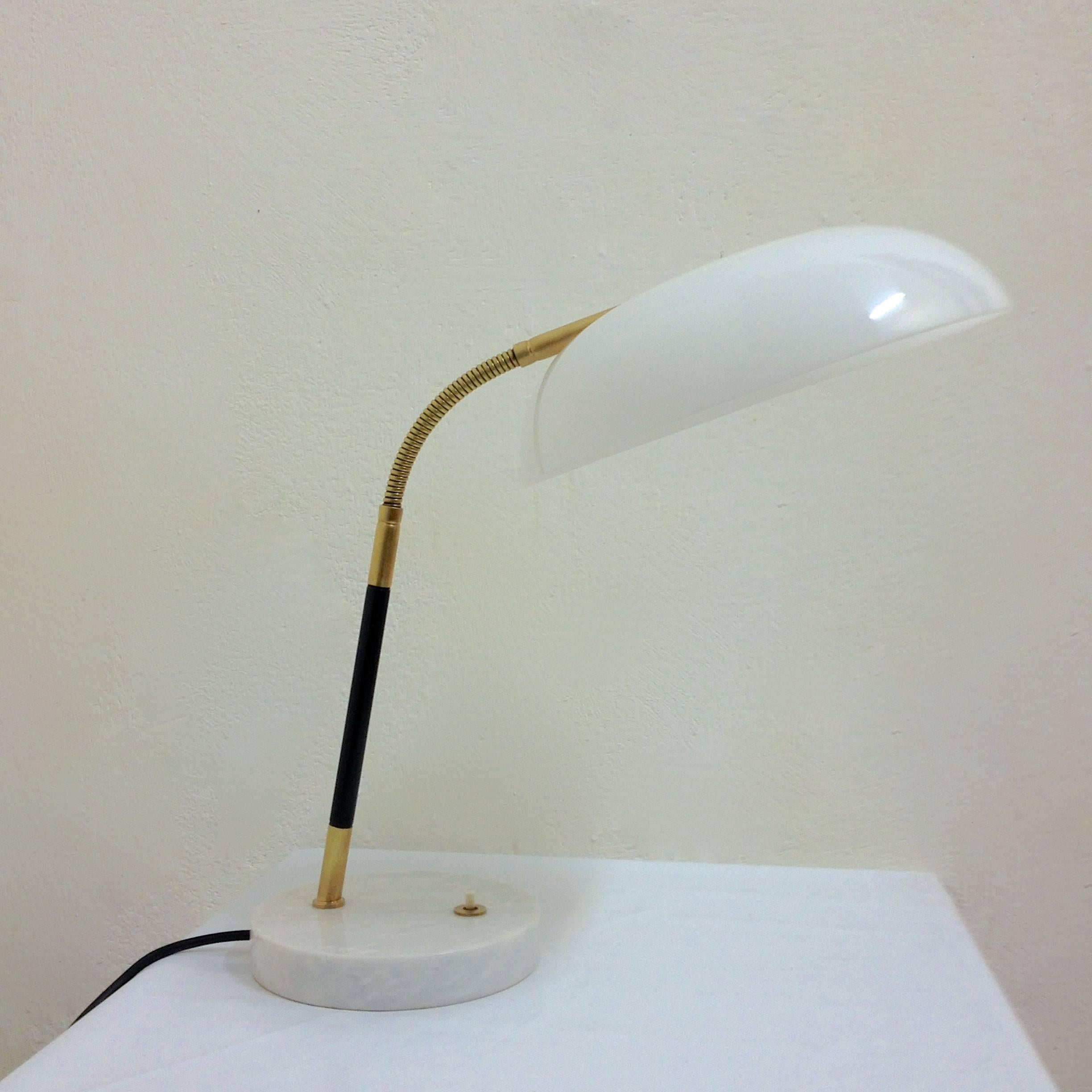 Italian desk lamp with white Carrara marble base, brass arm and details with height adjustable rounded shade.