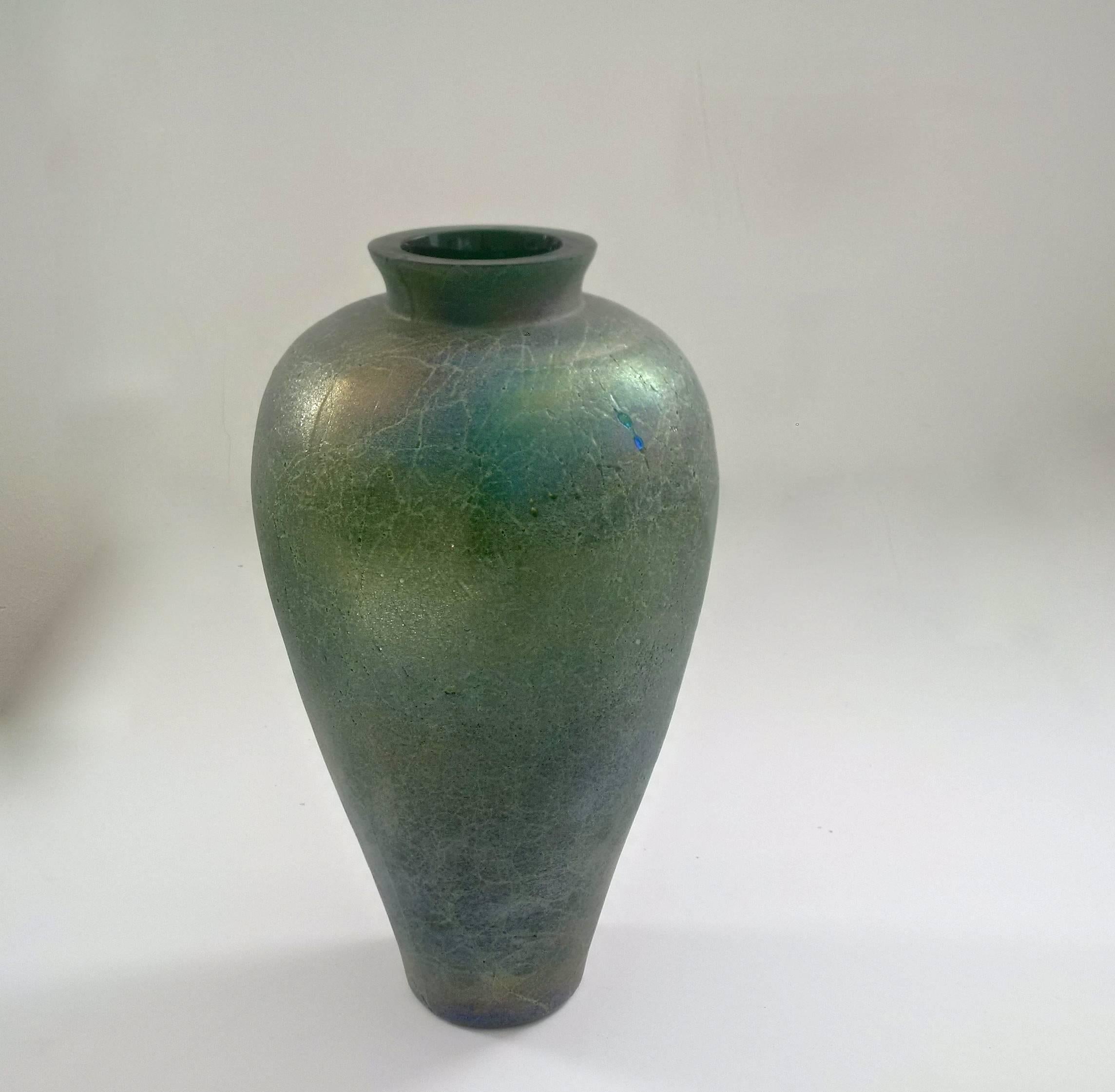 Large and beautifully Amphora shaped vase of thick emerald green glass applied with gold leaves and heavily oxidized metal particles. The Scavo technique creates the look of excavated roman glass. The iridescence lets this vase transform its colors