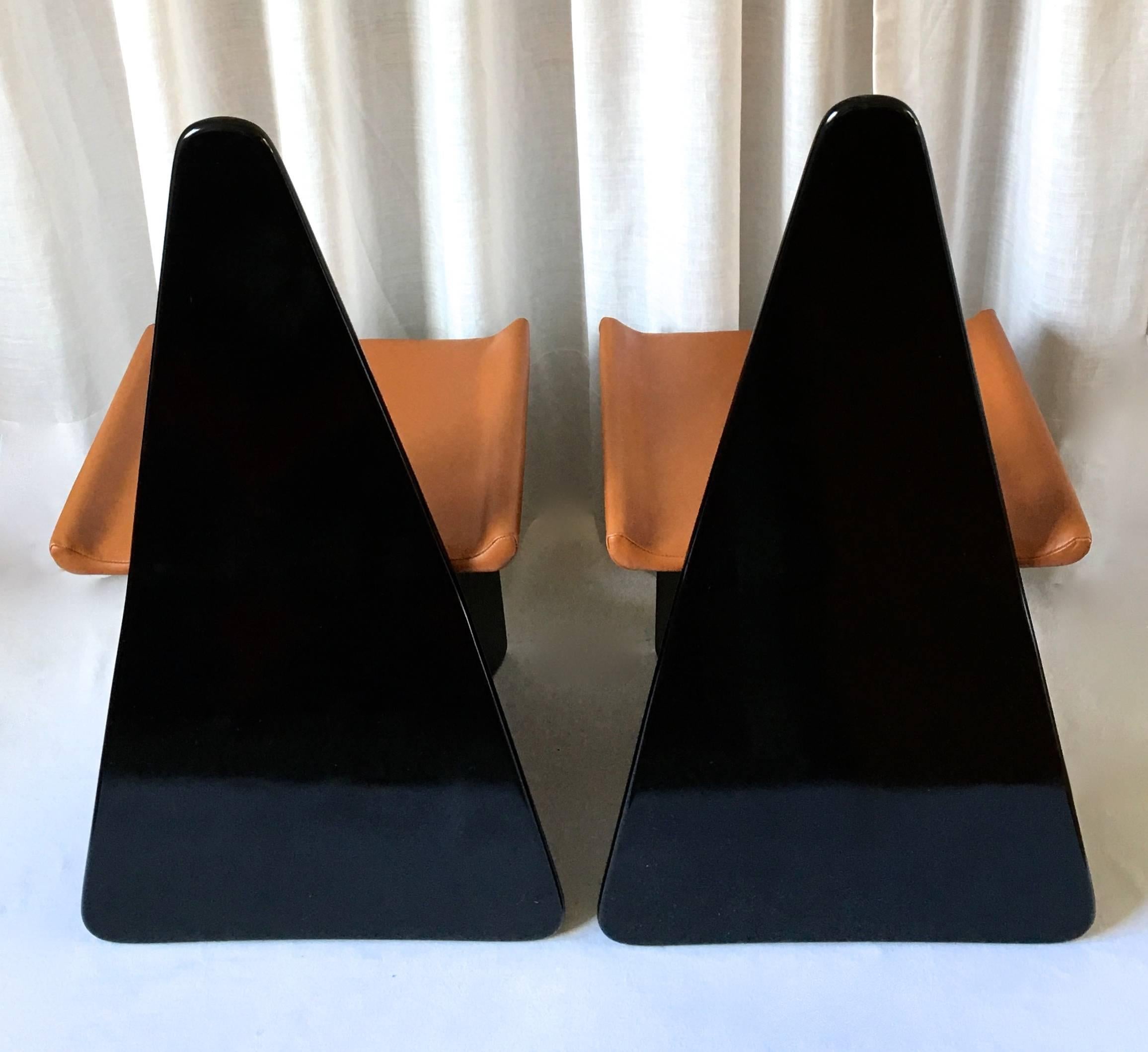 A pair of Claudio Salocchi chairs designed for Sormani, Italy, circa 1970-1975 as part of the serie Napoleone. Black lacquered wood and cognac brown leather. This is a rare 'Variante' edition.
Marked "Sormani" on the fabric on the bottom.