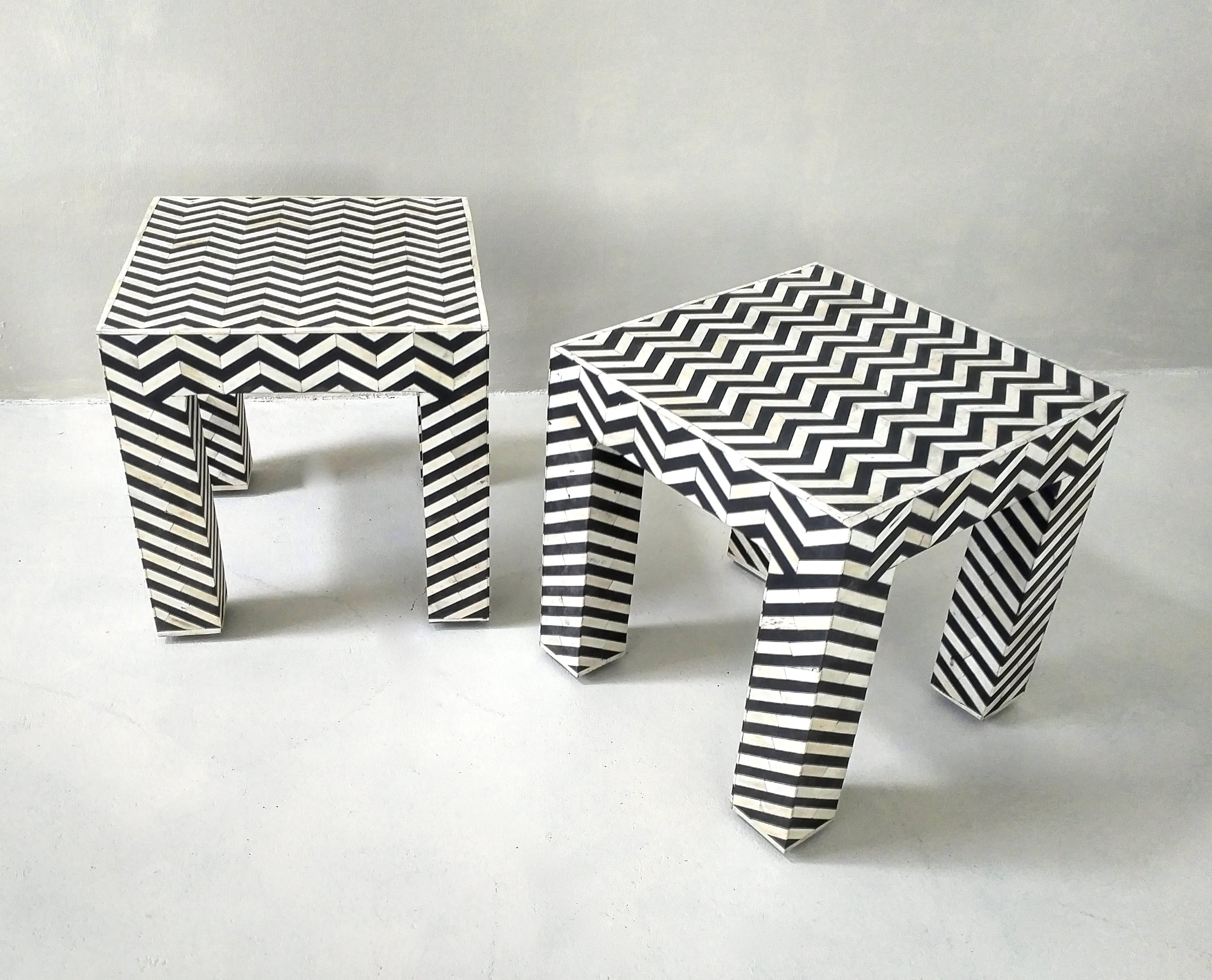 Wonderful pair safari or pop-art style side tables with black and white bone inlay in a geometric pattern on a wooden base.