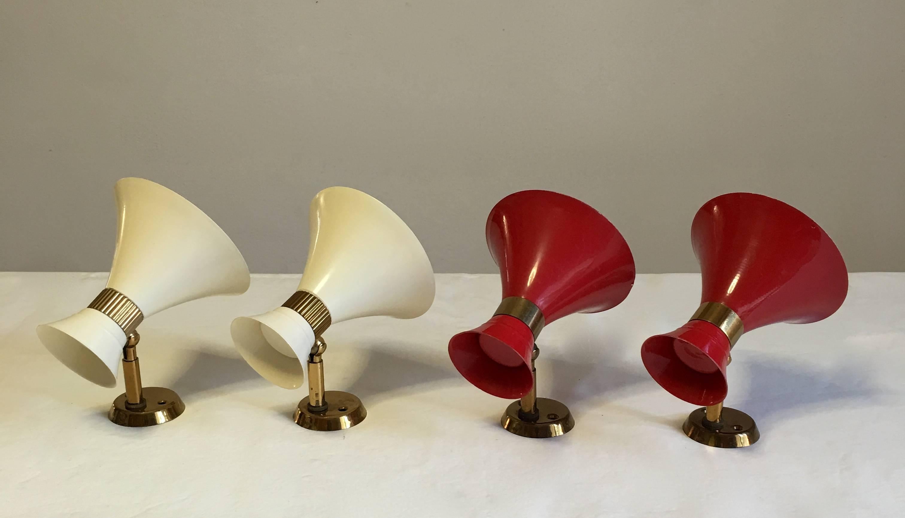 Brass and painted metal sconces in red and white, adjustable in several angles and beautiful details. Rewired.