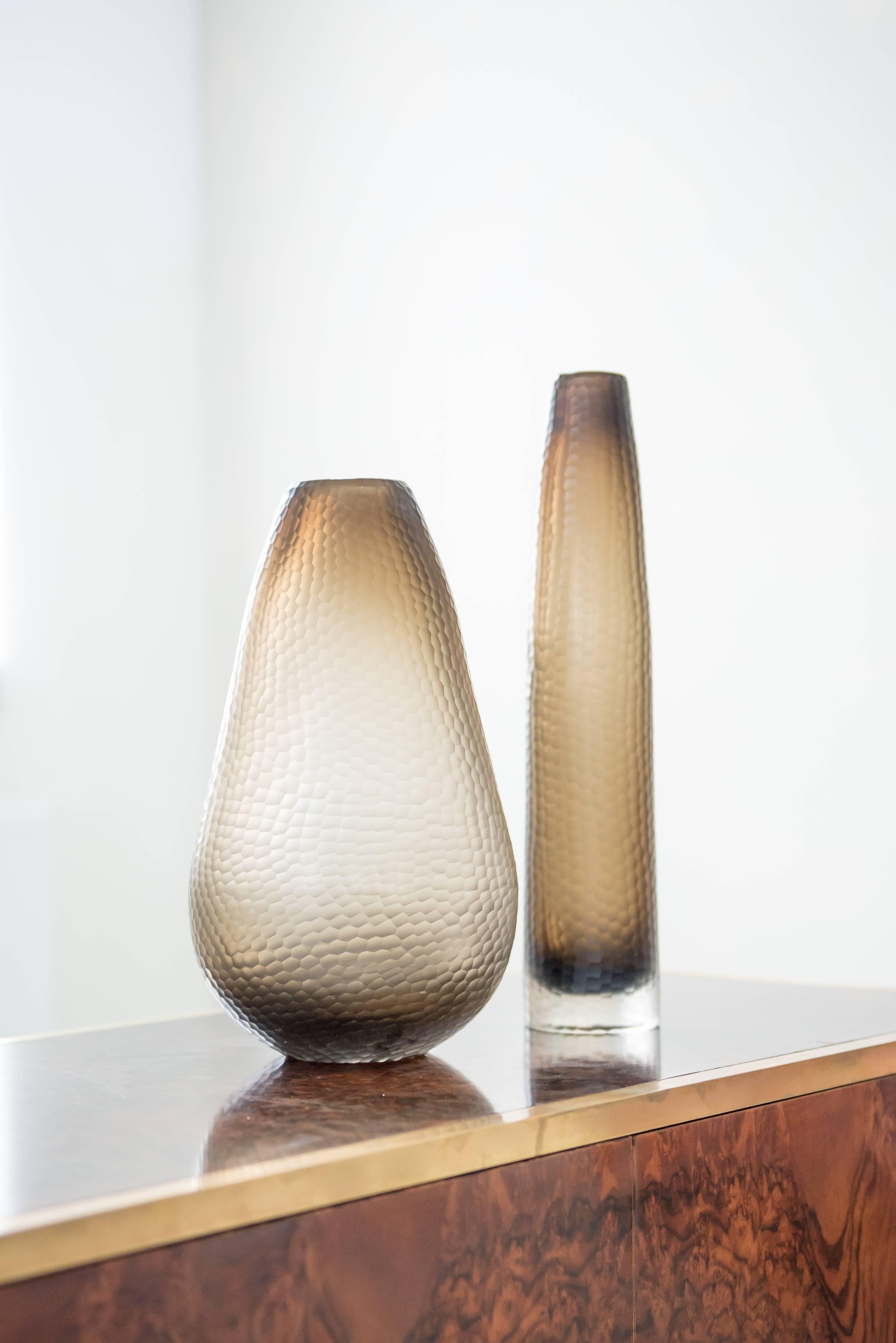Two vases in battuto technique. A technique that was invented by Carlo Scarpa in 1940 for Venini, intending the surface to resemble beaten silver or of worked stone.
The grey brown hues are very soft and change in the light.

Wide vase: 34 cm x 20