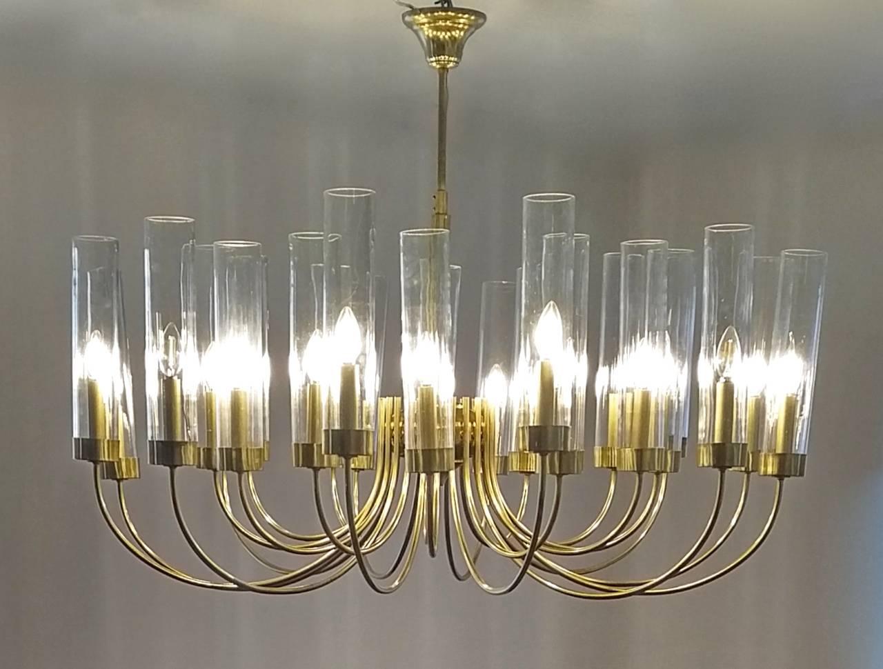An impressive Mid-Century chandelier from Italy with 24 curved arms in two sections, one inner and one outer. Handblown Murano glass cylinders.