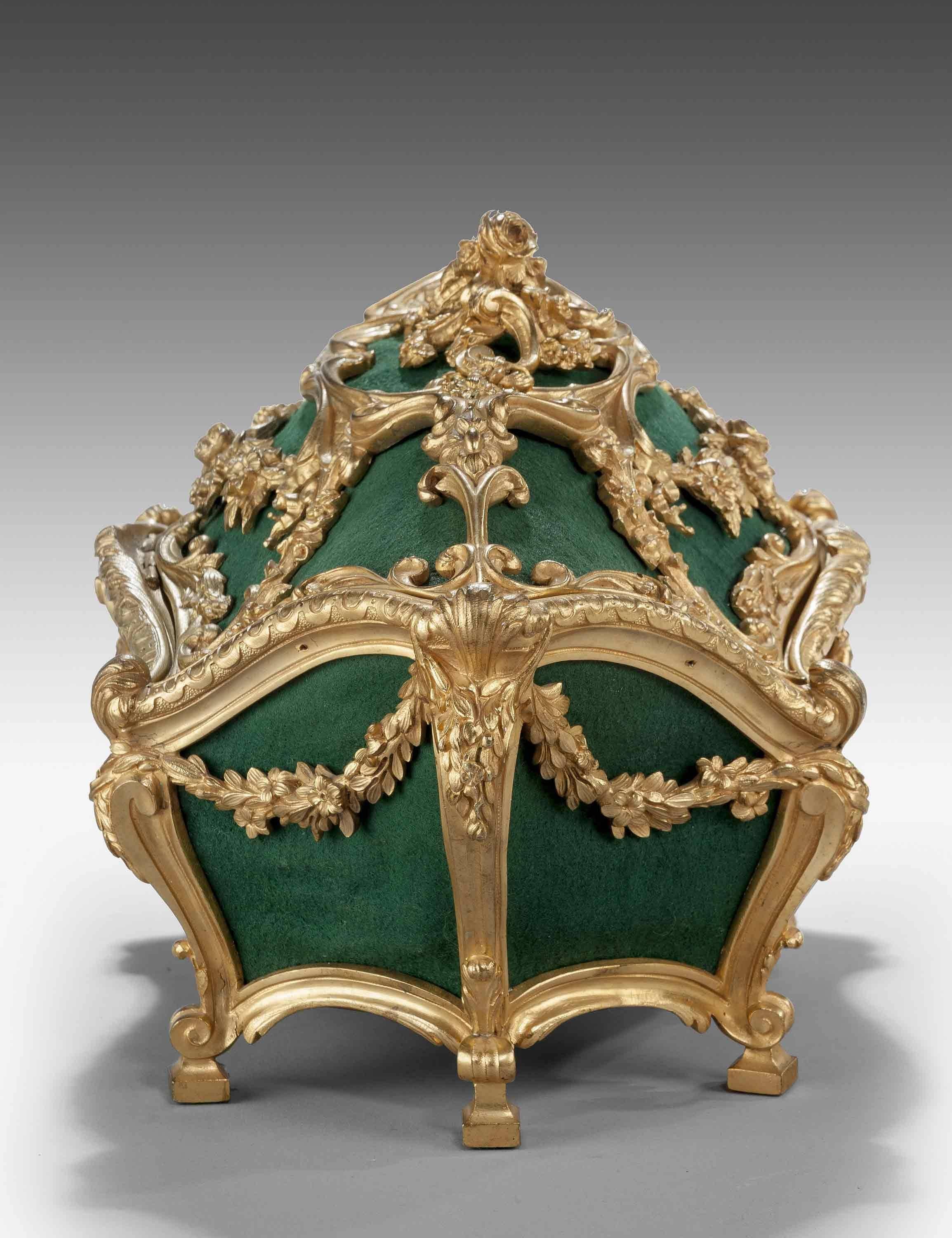 Very fine mid-19th century gilt bronze casket of complex Rococo form, decorated with foliage wreaths and flowers.

