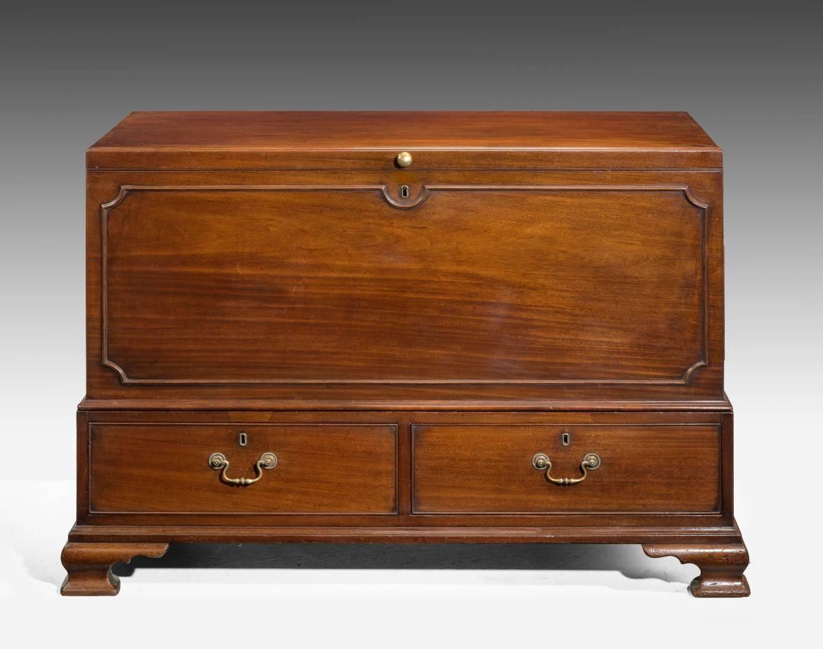 A fine quality Chippendale period mahogany lift lid chest. With shaped borders, original ogee bracket feet and very Fine cast original handles to the two based drawers. Excellent original overall condition.