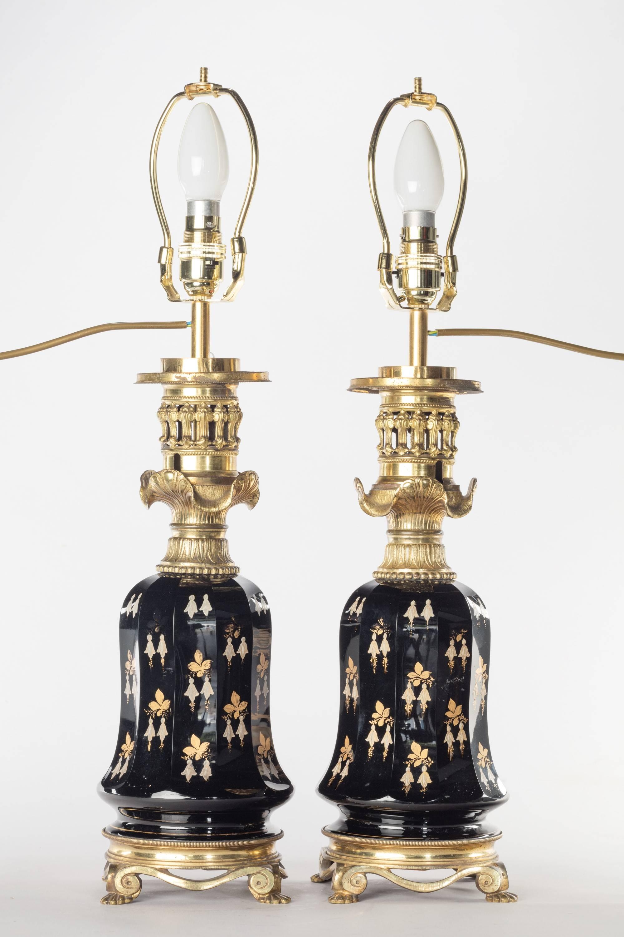 A most attractive pair of faceted glass vases. Fine gilded decoration, retaining original gilt bronze pierced bases and elaborate top.