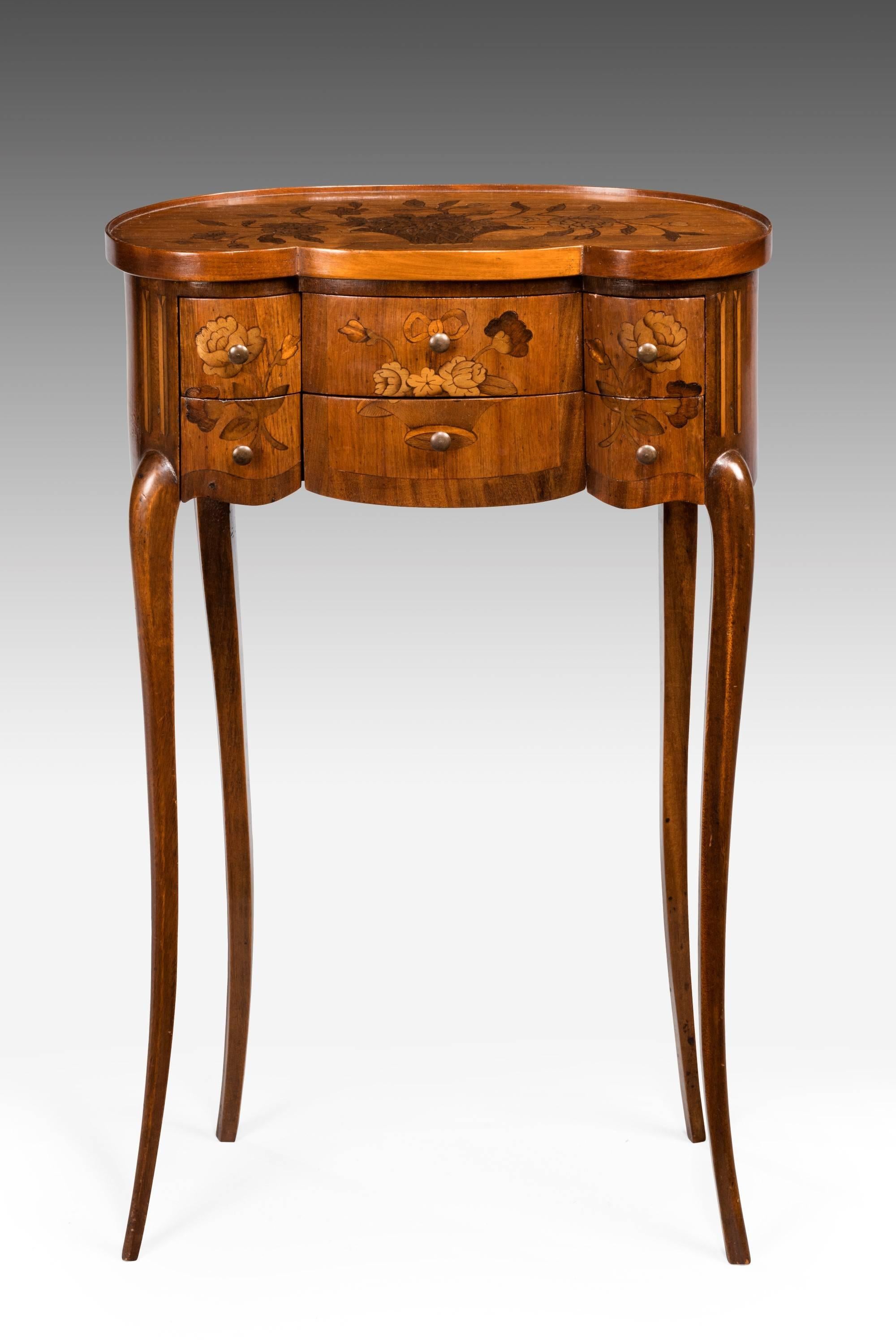 Late 19th century Continental marquetry commode. The top and front inlaid with flowers. On very slender supports. Triple serpentine front with a well shaped top. Very fine slender gallery.