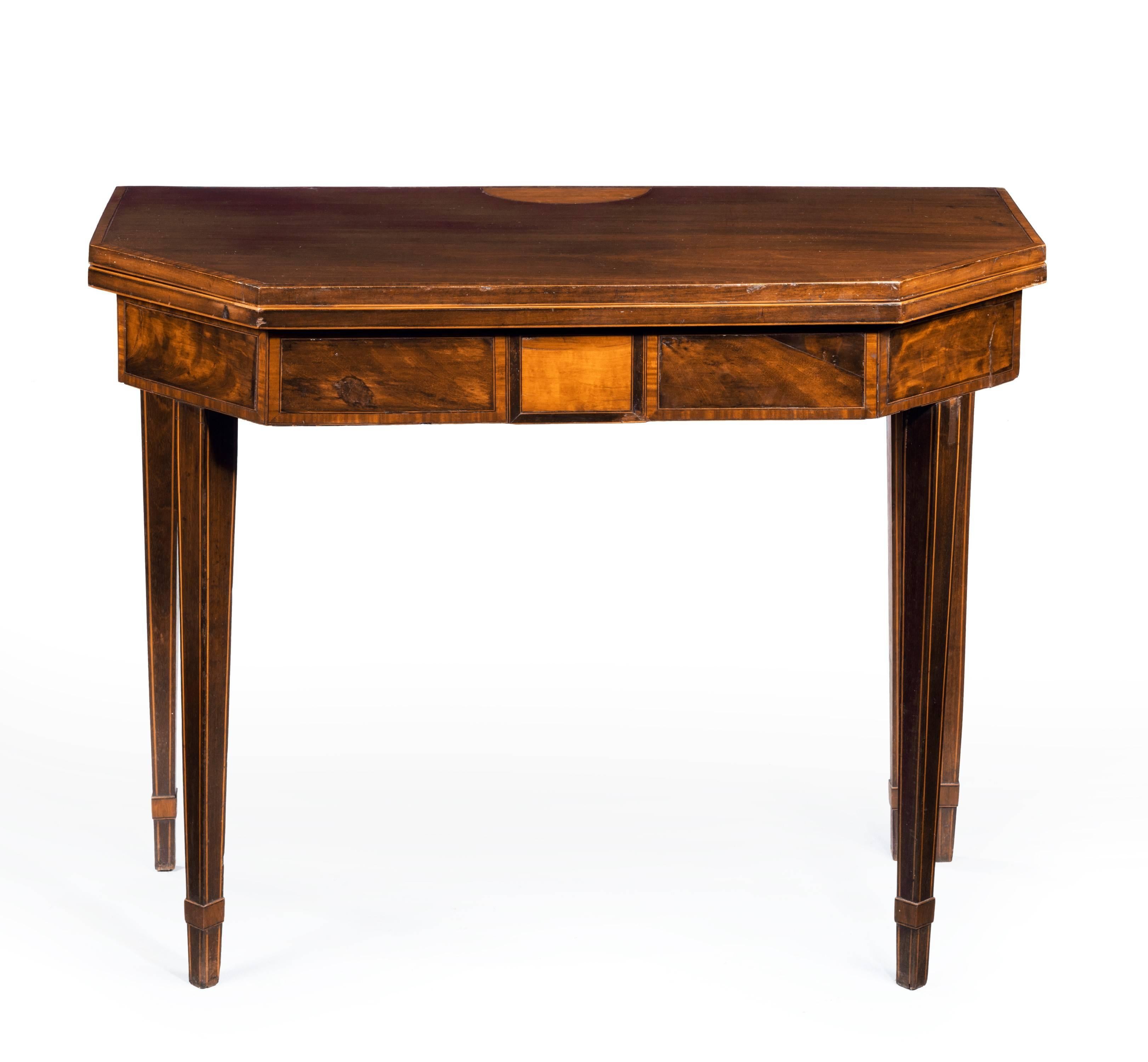 A good George III period mahogany tea table. Overall crossbanded with kingwood lined with ebony and satinwood. Tapering square section supports.